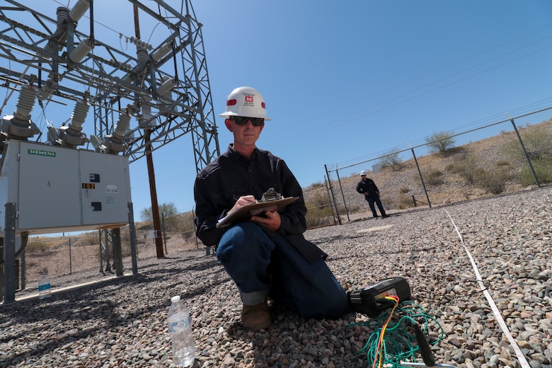 Staff Sgt. Jacob Wratchford (left) and Sgt. Eduardo Delacruz, Alpha Company, 249th Engineer Battalion, U.S. Army Corps of Engineers, are testing a San Carlos Irrigation Project's substation grounding May 19 by testing soil conductivity. The 249th is charged with the rapid deployment of U. S. Army generators to support worldwide requirements.