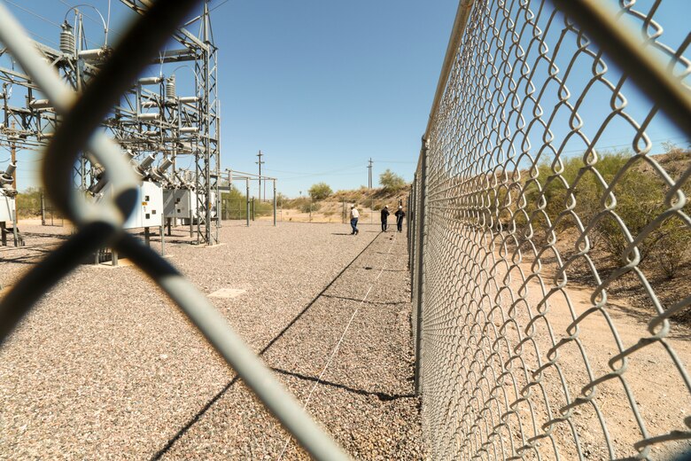 George Gorman (left), a supervisory electrician with the San Carlos Irrigation Project, ensures site safety May 19 as Staff Sgt. Jacob Wratchford and Sgt. Eduardo Delacruz, Alpha Company, 249th Engineer Battalion, U.S. Army Corps of Engineers test a San Carlos Irrigation Project's substation grounding by testing soil conductivity. The 249th is charged with the rapid deployment of U. S. Army generators to support worldwide requirements.