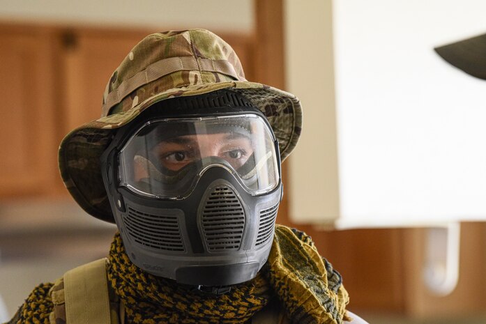 An Airman receives a brief from a opposing force manager.