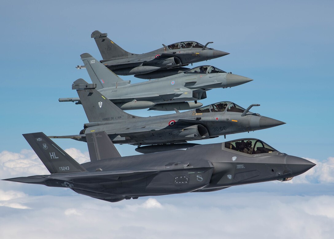 U.S. Air Force, French and Royal Air Force fighter aircraft participate in formation flight