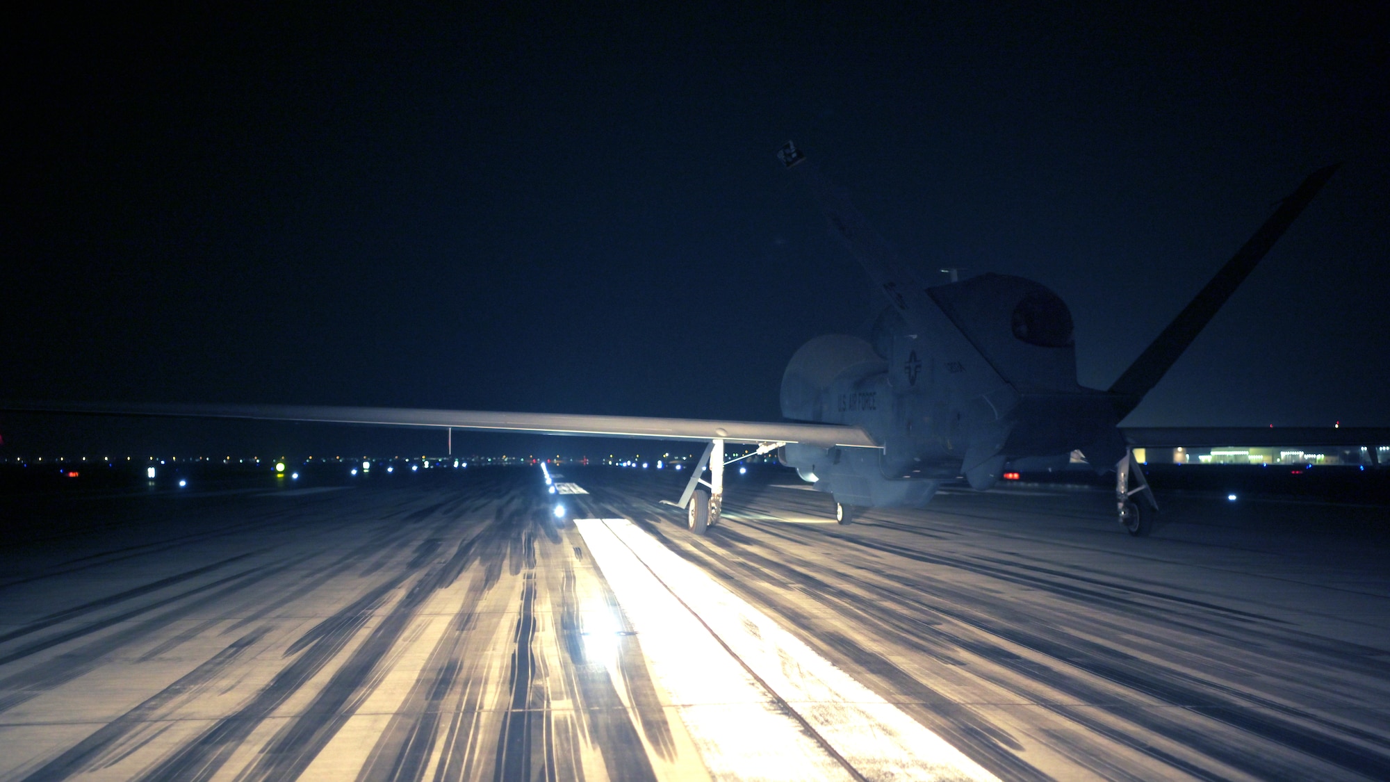 A U.S. Air Force Airmen from the 380th Expeditionary Aircraft Maintenance Squadron, prepare to launch an RQ-4 Global Hawk at Al Dhafra Air Base, United Arab Emirates, May 7, 2021, 2021. The Global Hawk’s mission is to provide a broad spectrum of intelligence, surveillance, and reconnaissance capabilities to support joint combatant forces. (U.S. Air Force photo by Staff Sgt. Jao'Torey Johnson)