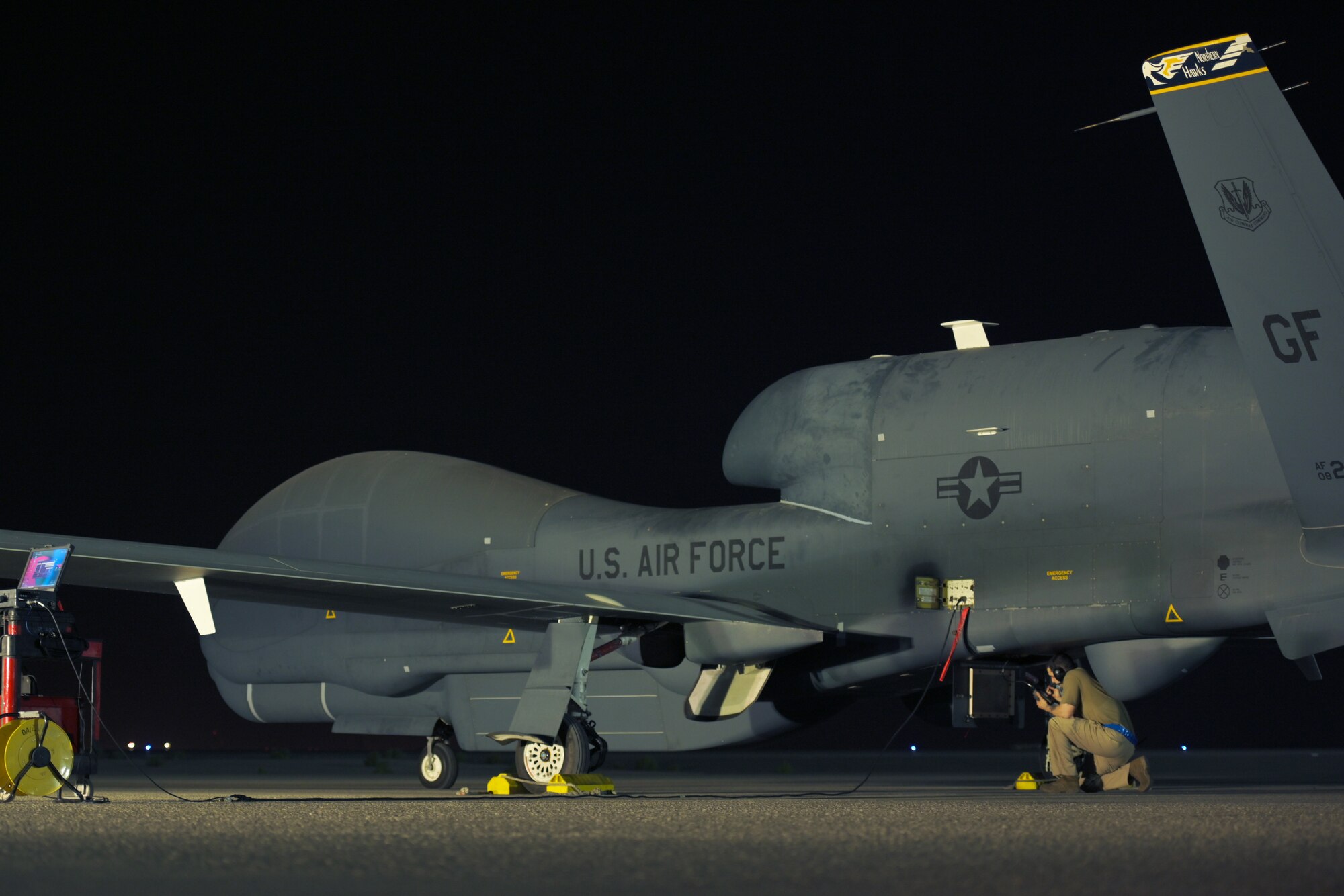 A U.S. Air Force Airmen from the 380th Expeditionary Aircraft Maintenance Squadron, prepare to launch an RQ-4 Global Hawk at Al Dhafra Air Base, United Arab Emirates, May 7, 2021, 2021. The Global Hawk’s mission is to provide a broad spectrum of intelligence, surveillance, and reconnaissance capabilities to support joint combatant forces. (U.S. Air Force photo by Staff Sgt. Jao'Torey Johnson)