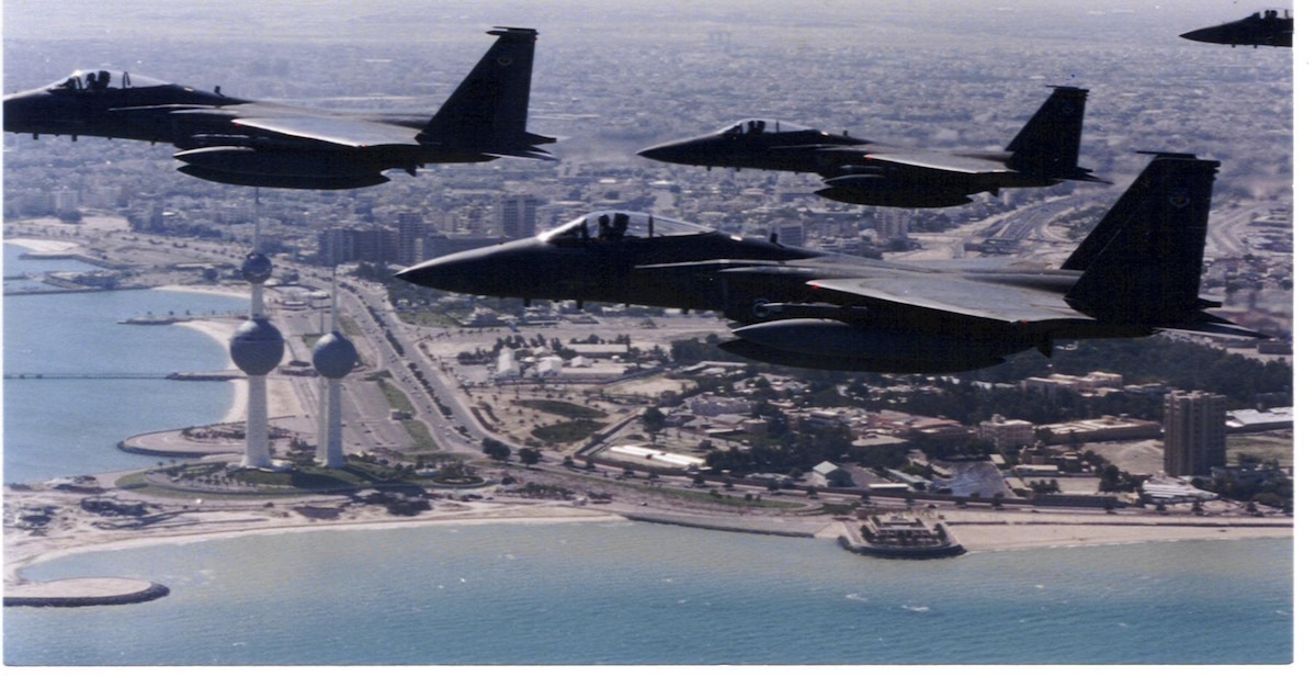 In this historic photo, a four-ship of F-15C Eagles, deployed from Eglin Air Force Base, fly over the Persian Gulf in the 1990s. The then-named 33rd Tactical Fighter Wing, flew combat air patrol and high value airbourne asset protection missions as part of Operations Desert Storm and Southern Watch. (Courtesy photo)