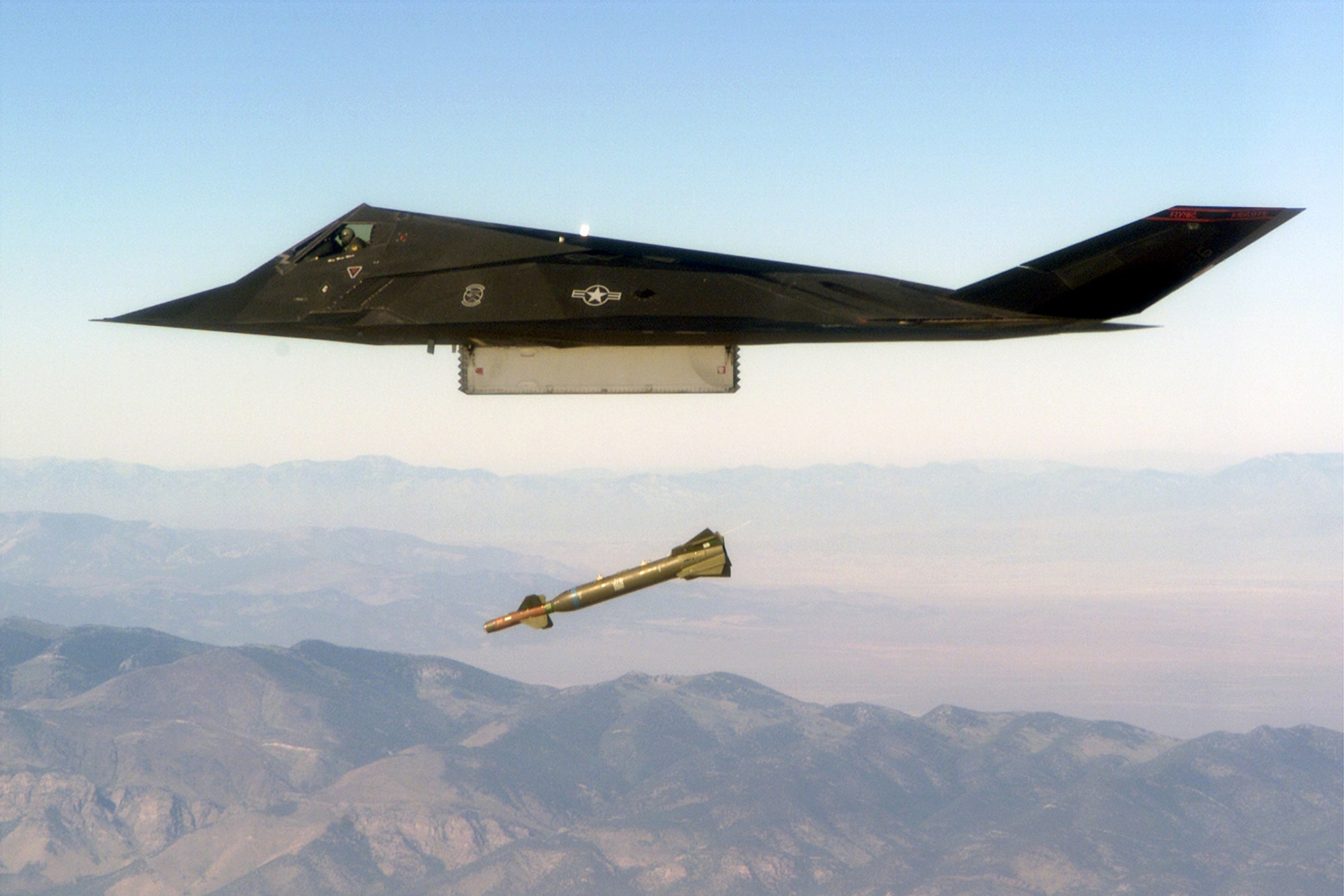 An F-117 Nighthawk engages it's target and drops a GBU-28 guided bomb unit during the 'live-fire' weapons testing mission COMBAT HAMMER, at Hill Air Force Base, Utah.