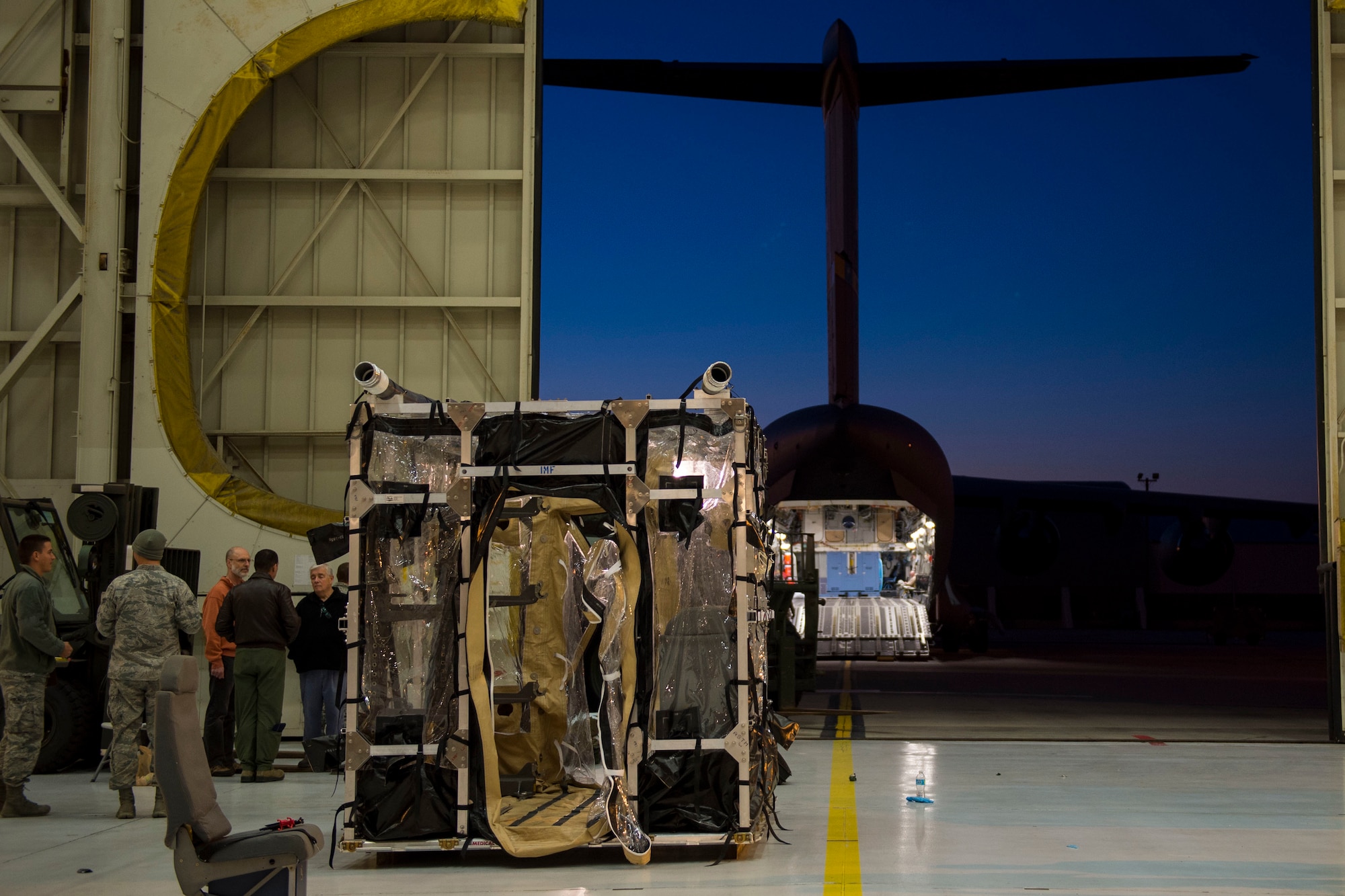 Airmen from Joint Base Charleston and the Air Force Operational Test and Evaluation Center build, test and evaluate the Transport Isolation System (TIS) at JB Charleston, Dec. 11, 2014. The TIS is a self-contained module system that can be used with either two or three sections, depending on aircraft space. It will be used to safely transport patients with an infectious disease. (U.S. Air Force photo by Airman 1st Class Taylor Queen/Released)