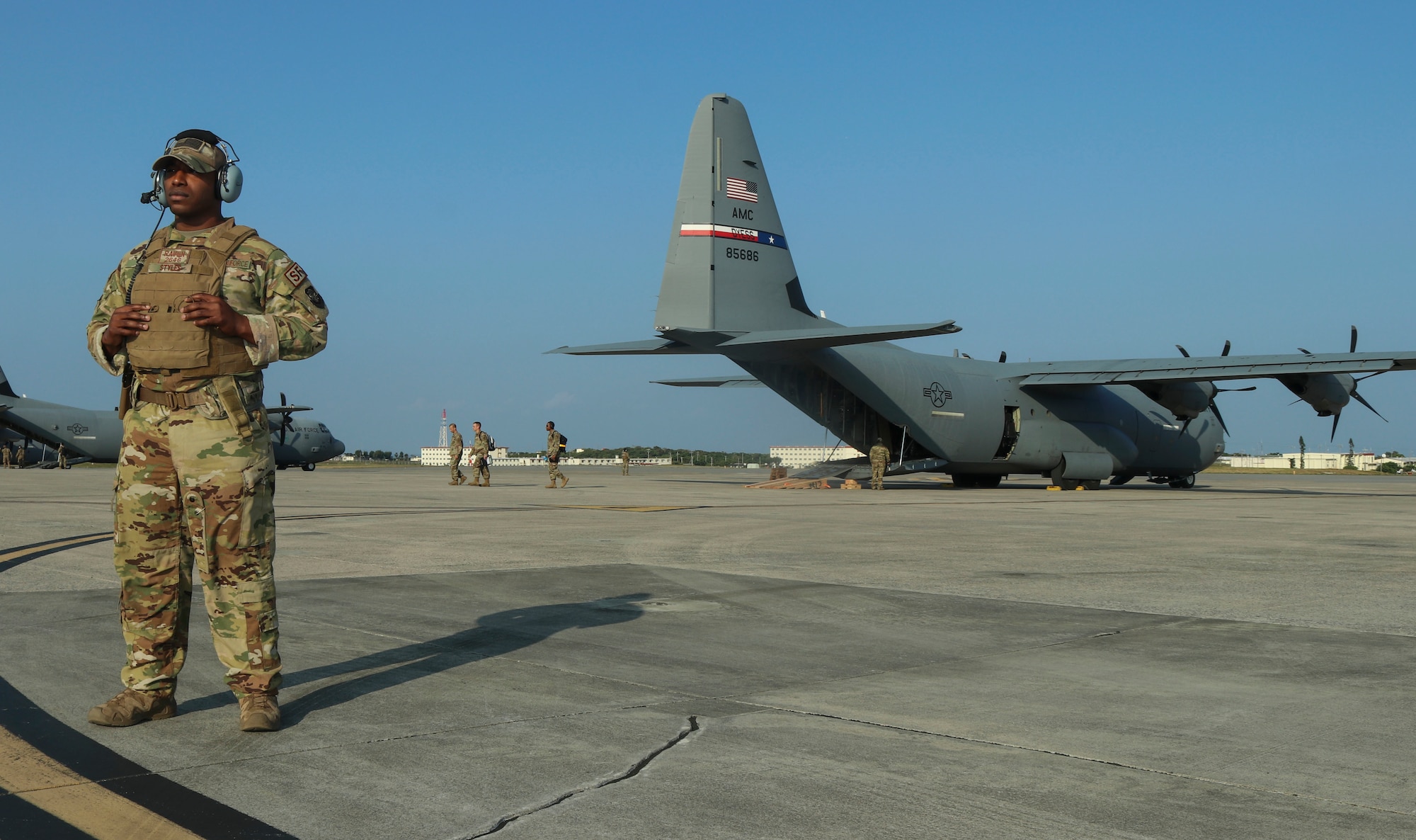 Staff Sgt. Gerald Styles, 60th Security Forces Squadron Raven, provides security for Airmen as they complete an Agile Combat Employment experiment at Marine Corps Air Station Futenma, Japan, Feb. 20, 2020. The Ravens secured the aircraft and enabled Airmen to accomplish their tasks in order to successfully complete their mission. (U.S. Air Force photo by Staff Sgt. David Owsianka)