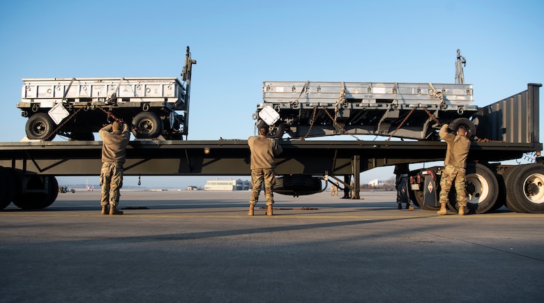 U.S. Air Force Airmen from the 52nd Logistics Readiness Squadron unload a trailer on the flightline at Ramstein Air Base, Germany, Jan. 22, 2020. 52nd Fighter Wing Airmen forward deployed from Spangdahlem Air Base, Germany, to conduct an Agile Combat Employment exercise. The wing plans to conduct ACE exercises at other locations in the future to generate aircraft in any environment and deter aggressors. (U.S. Air Force photo by Airman 1st Class Valerie Seelye)
