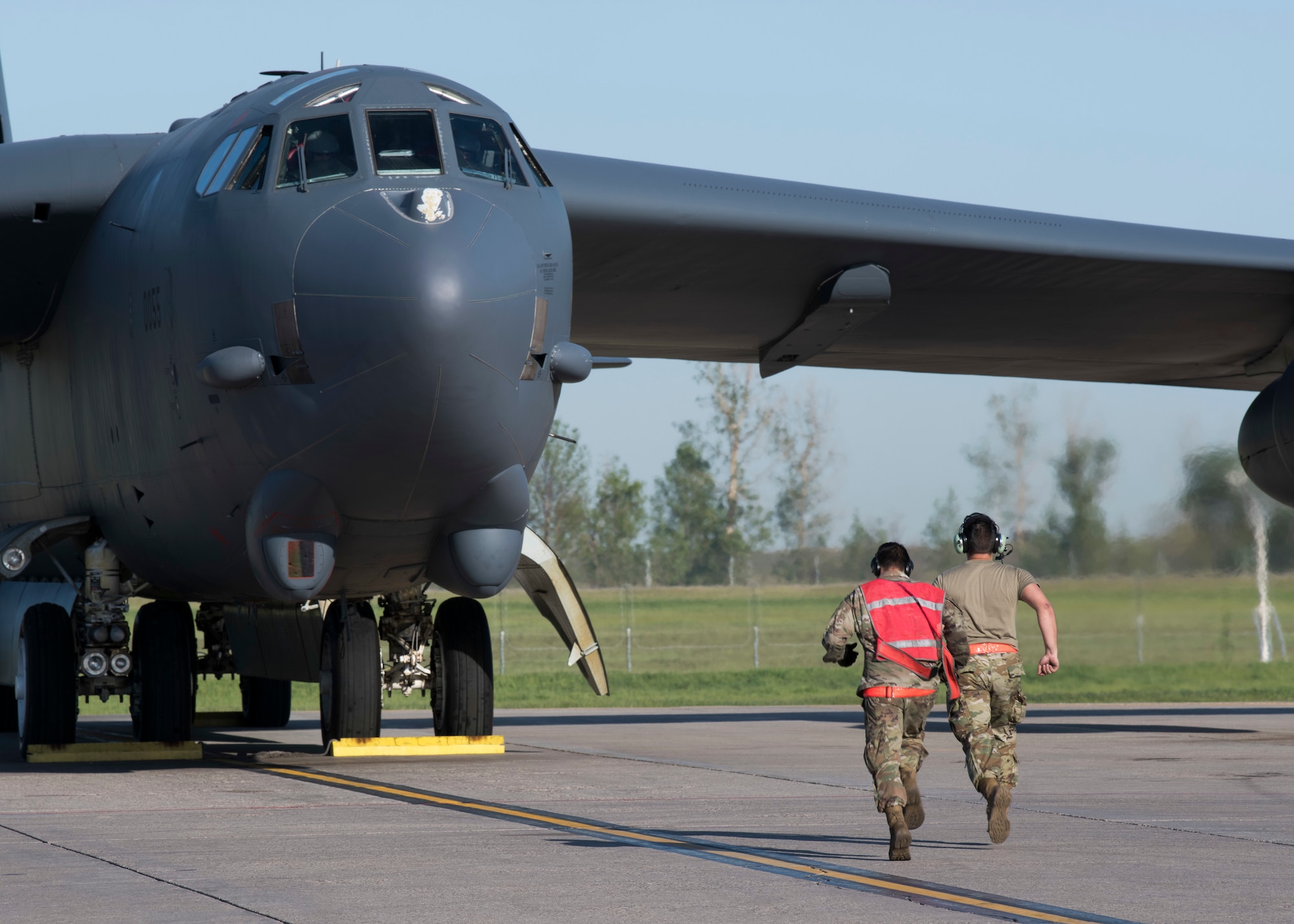 From left, Airmen 1st Classes Rubio Steven and Ian Arriaza, 5th Aircraft Maintenance Squadron crew chiefs, prepare a B-52H Stratofortress for takeoff at Minot Air Force Base, North Dakota, June 2, 2020. The B-52s are conducting a long-range, long duration strategic Bomber Task Force mission throughout Europe and the Arctic region. (U.S. Air Force photo by Senior Airman Alyssa Day)