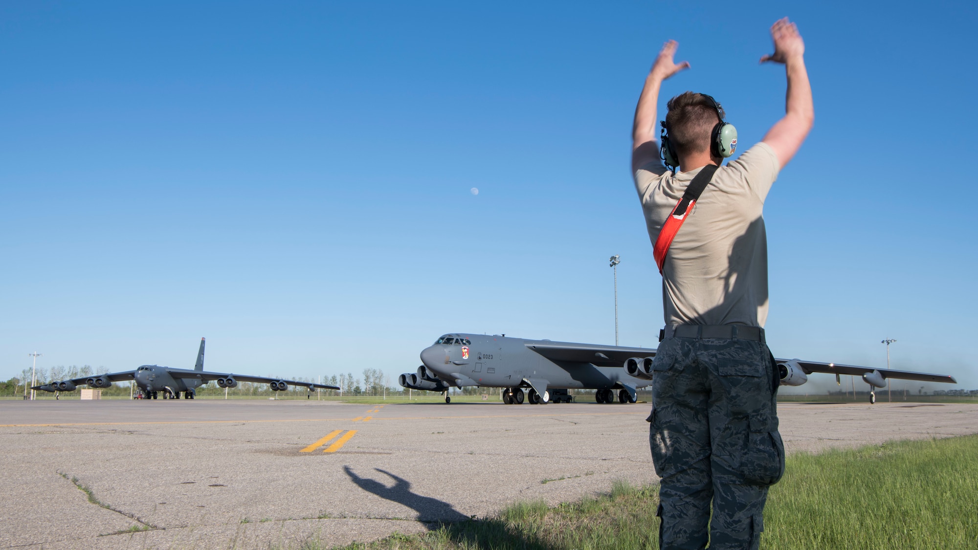 Airman 1st Class Jarrett Warrick, 5th Aircraft Maintenance Squadron crew chief, prepares a B-52H Stratofortress for takeoff at Minot Air Force Base, North Dakota, June 2, 2020. During flight, the B-52s will perform joint and combined training, exercises, and operations to help mitigate and reduce security risks associated with increased human activity in the Arctic. (U.S. Air Force photo by Senior Airman Alyssa Day)