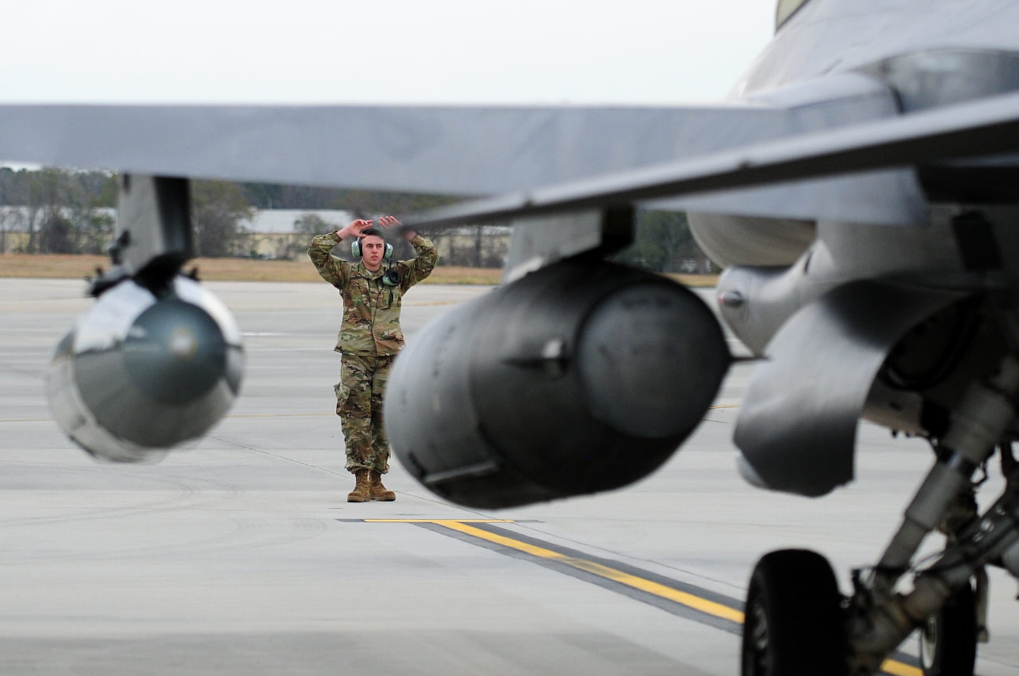 A crew chief from the 148th Fighter Wing recovers a Block 50CM, F-16 while deployed in support of a NORAD tasked Operation NOBLE EAGLE mission. NORAD conducts aerospace warning, aerospace control and maritime warning in the defense of North America. (U.S. Air National Guard photo by Master Sgt. Tom Krob)