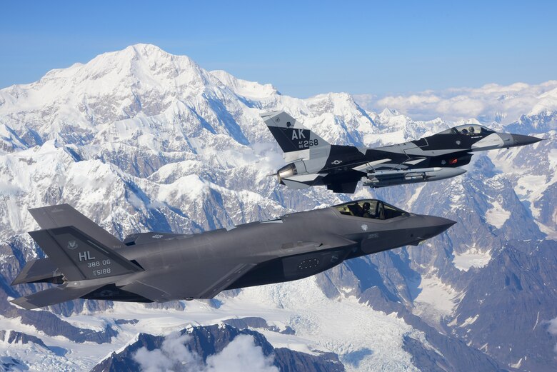 An F-35A Lightning II, assigned to the 388th Fighter Wing at Hill Air Force Base in Utah, and an F-16 Fighting Falcon, assigned to the 18th Aggressor Squadron at Eielson Air Force Base in Alaska, fly over Denali National Park, Alaska, Aug. 17, 2020. The 388th FW joined the 354th Fighter Wing for RED FLAG-Alaska 20-3, the Pacific Air Forces' premier large force exercise. (U.S. Air Force photo by Tech. Sgt. Jerilyn Quintanilla)