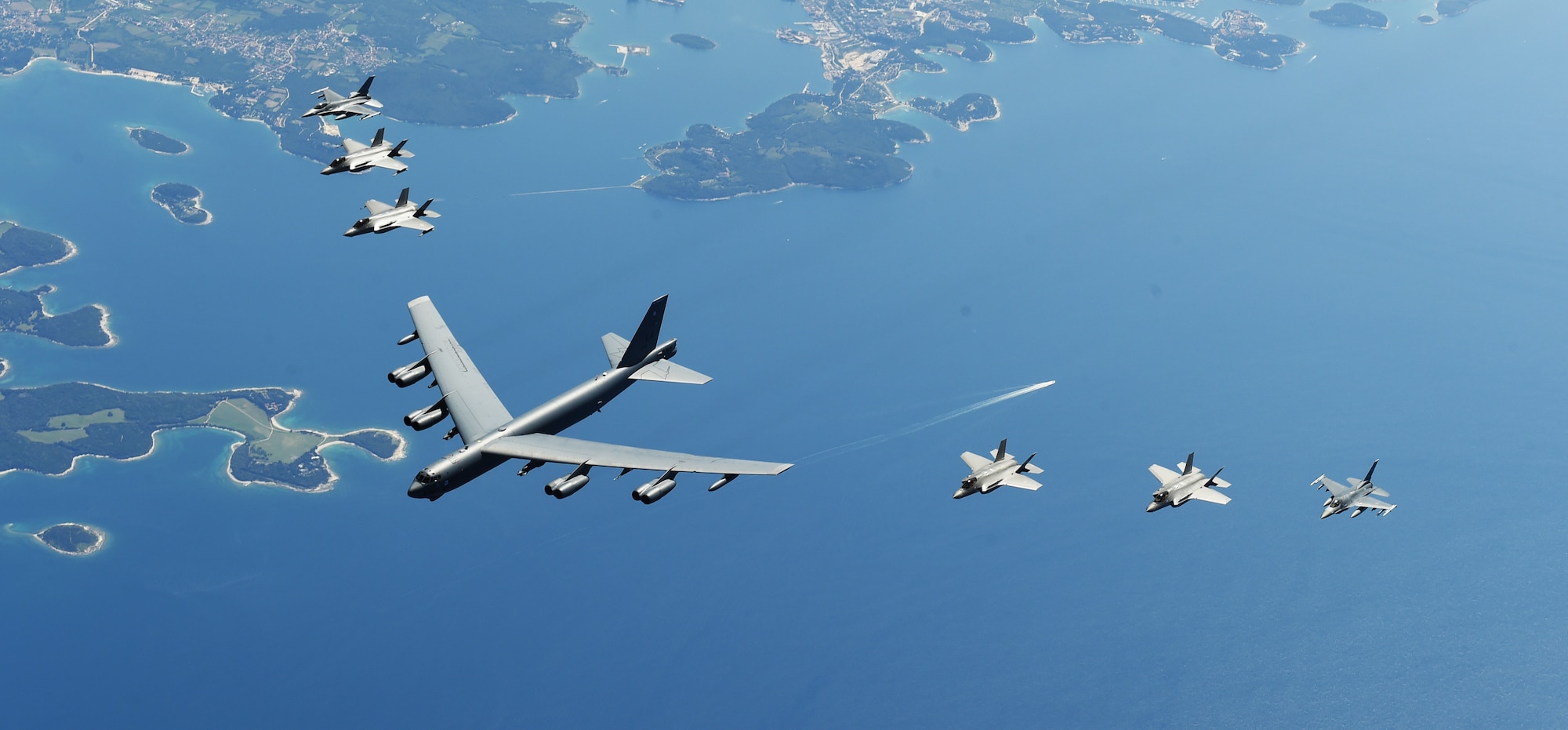 U.S. and Italian Air Force aircraft consisting of F-35 Lightning IIs, F-16 Fighting Falcons and a B-52 Stratofortress, fly in formation over the Adriatic Sea during exercise Astral Knight 19, June 4, 2019. Astral Knight takes place throughout various locations in Europe, involving more than 900 Airmen and supports the collective defense and security of NATO allies and U.S. forces in Europe. (U.S. Air Force photo by Staff Sgt. Joshua R. M. Dewberry)