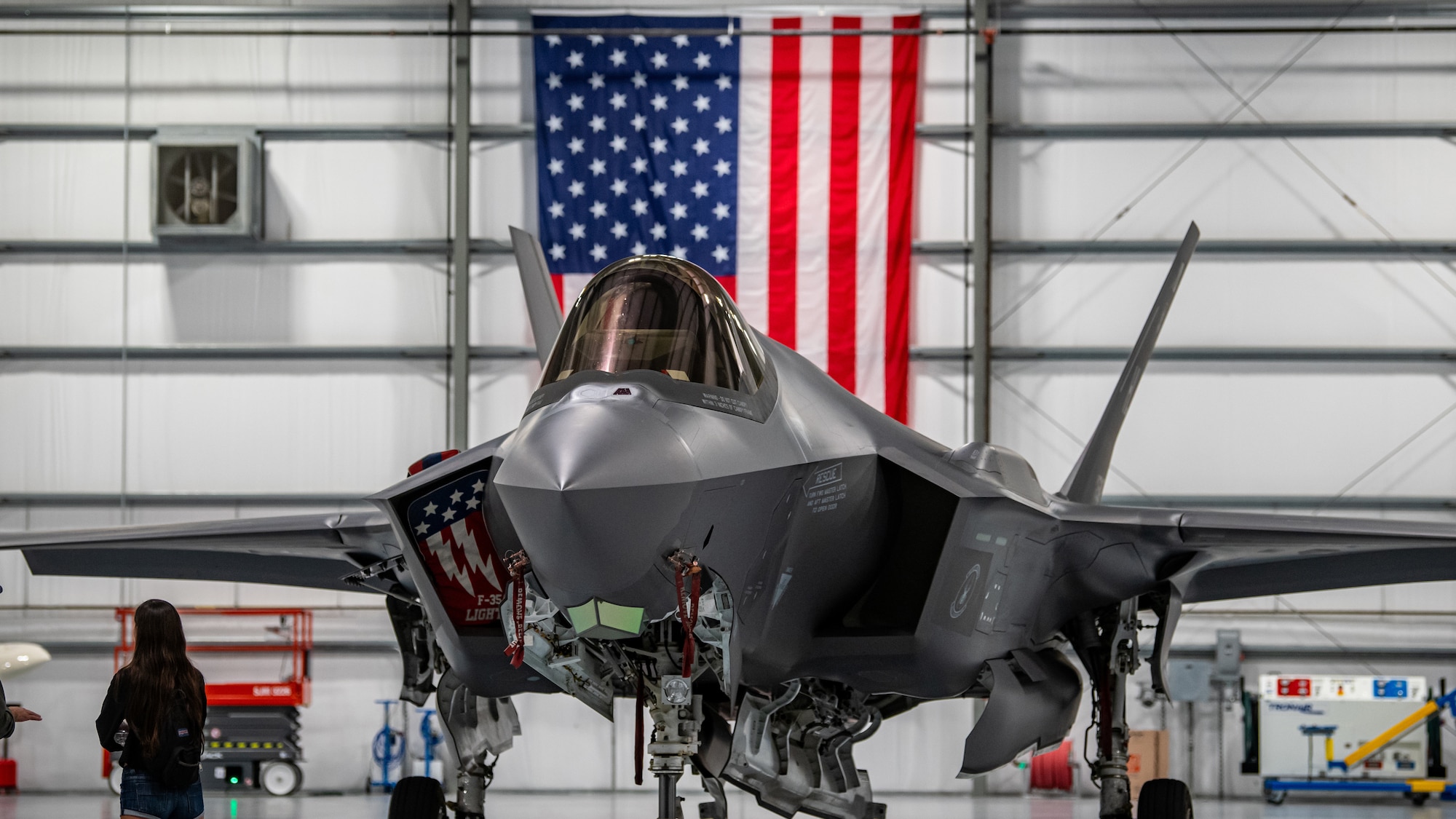 An F-35A Lightning ll sits in a hangar at Lakeland Linder International Airport, Lakeland, Fla., following an aerobatic routine by the F-35A Lightning ll demonstration team at the Sun 'n Fun Holiday Flying Festival, Dec. 4, 2020. The Lightning II is a stealth-capable, multi-role attack fighter designed to penetrate the most hostile areas of the world without the threat of detection. (U.S. Air Force photo by Staff Sgt. Codie Trimble)