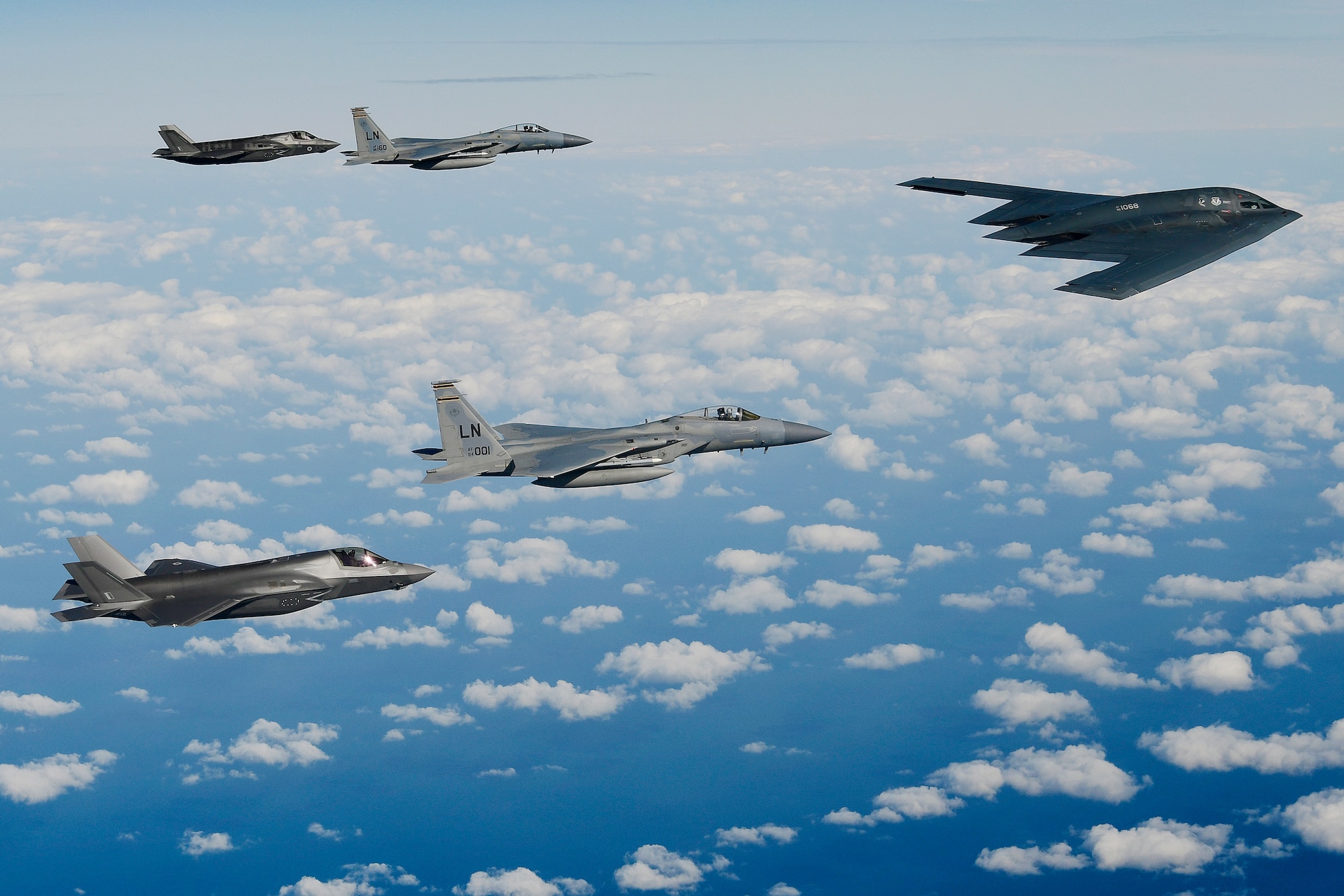 A B-2A Spirit bomber assigned to the 509th Bomb Wing leads a delta formation consisting of two F-15C Eagles assigned to the 48th Fighter Wing and two Royal Air Force F-35B Lightning IIs as they conduct aerial operations over the North Sea, Sept. 16, 2019. The 48th Fighter Wing and the Royal Air Force routinely train with integrated fourth and fifth-generation capabilities to deliver full spectrum air combat support to European allies and partners. (U.S. Air Force photo by Tech. Sgt. Matthew Plew)