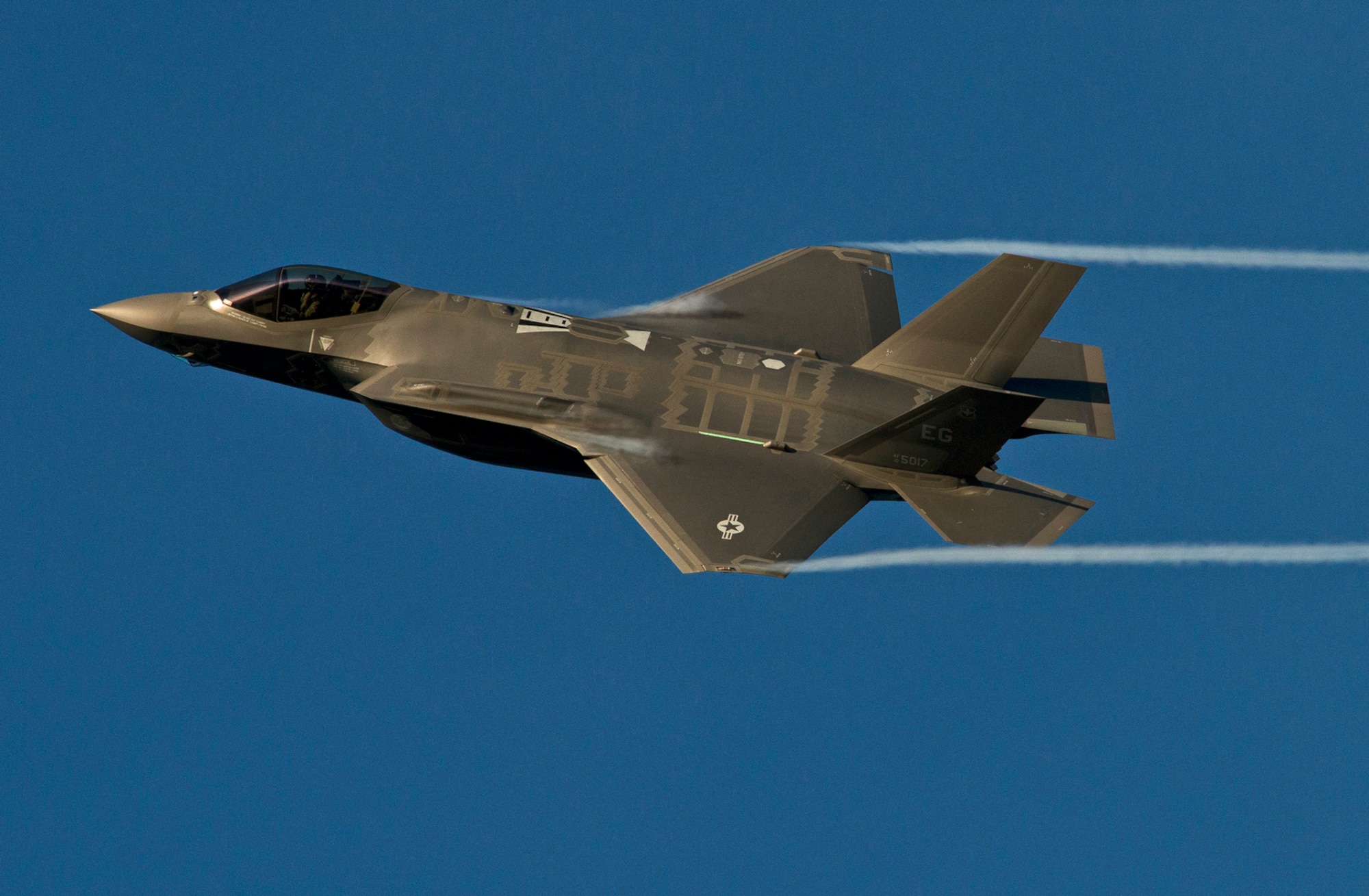 An F-35A Lightning II from the 33rd Fighter Wing streaks across the sky above Eglin Air Force Base, Fla. while coming in for landing after a training sortie. The 33rd Fighter Wing is responsible for F-35 A/B/C Lightning II pilot and maintainer training for the Marine Corps, the Navy, the Air Force and, in the future, at least eight coalition partners. Initially, 59 aircraft and three flying squadrons, one for each service/aircraft variant, will be established at Eglin. (U.S. Air Force photo/Tech. Sgt. Bennie J. Davis III)