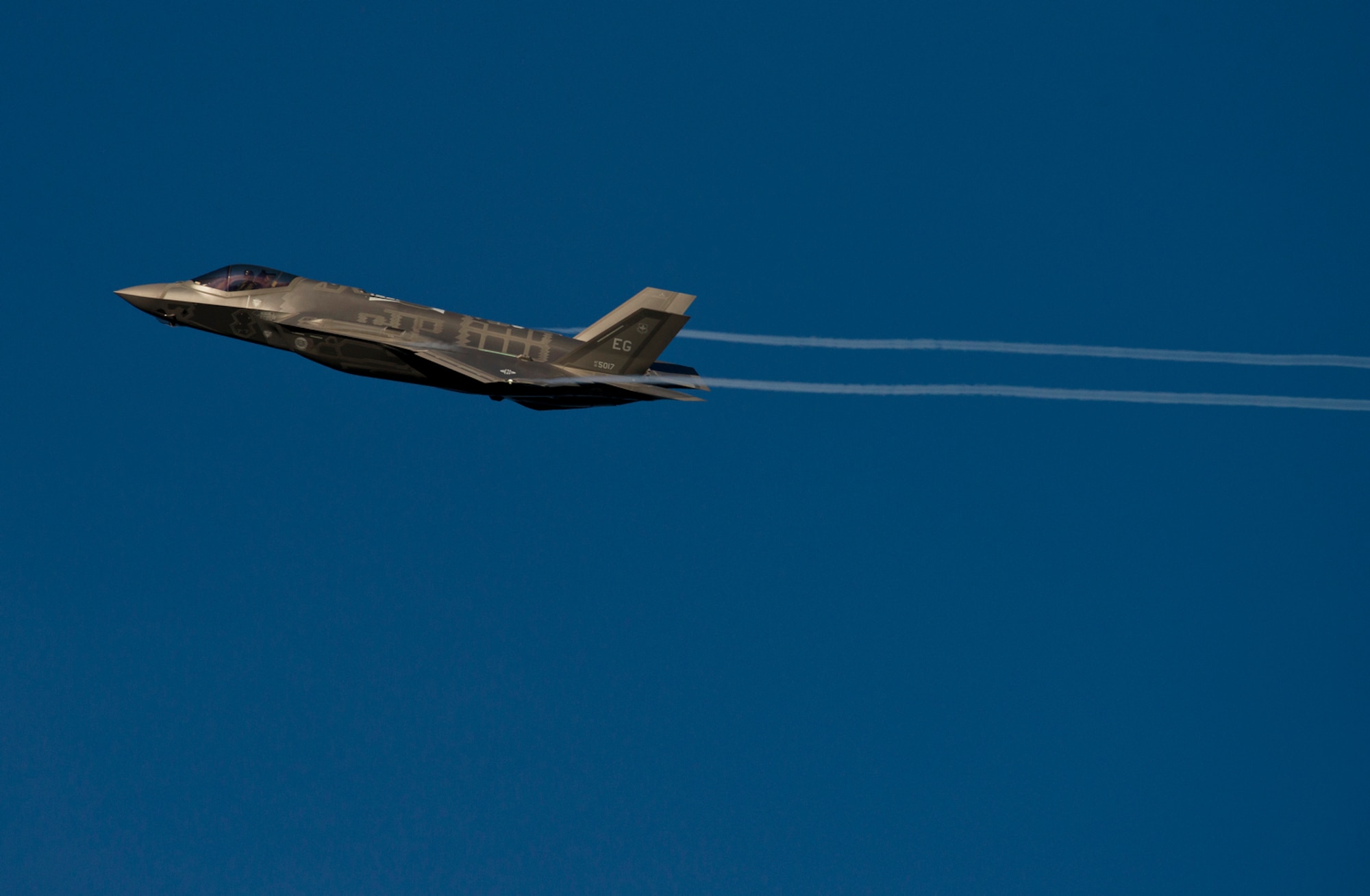 A F-35A Lightning II from the 33rd Fighter Wing streaks across the sky above Eglin Air Force Base, Fl. while coming in for landing after a training sortie. The 334rd Fighter Wing is responsible for F-35 A/B/C Lightning II pilot and maintainer training for the Marine Corps, the Navy, the Air Force and, in the future, at least eight coalition partners. Initially, 59 aircraft and three flying squadrons, one for each service/aircraft variant, will be established at Eglin. (U.S. Air Force photo/Tech. Sgt. Bennie J. Davis III)