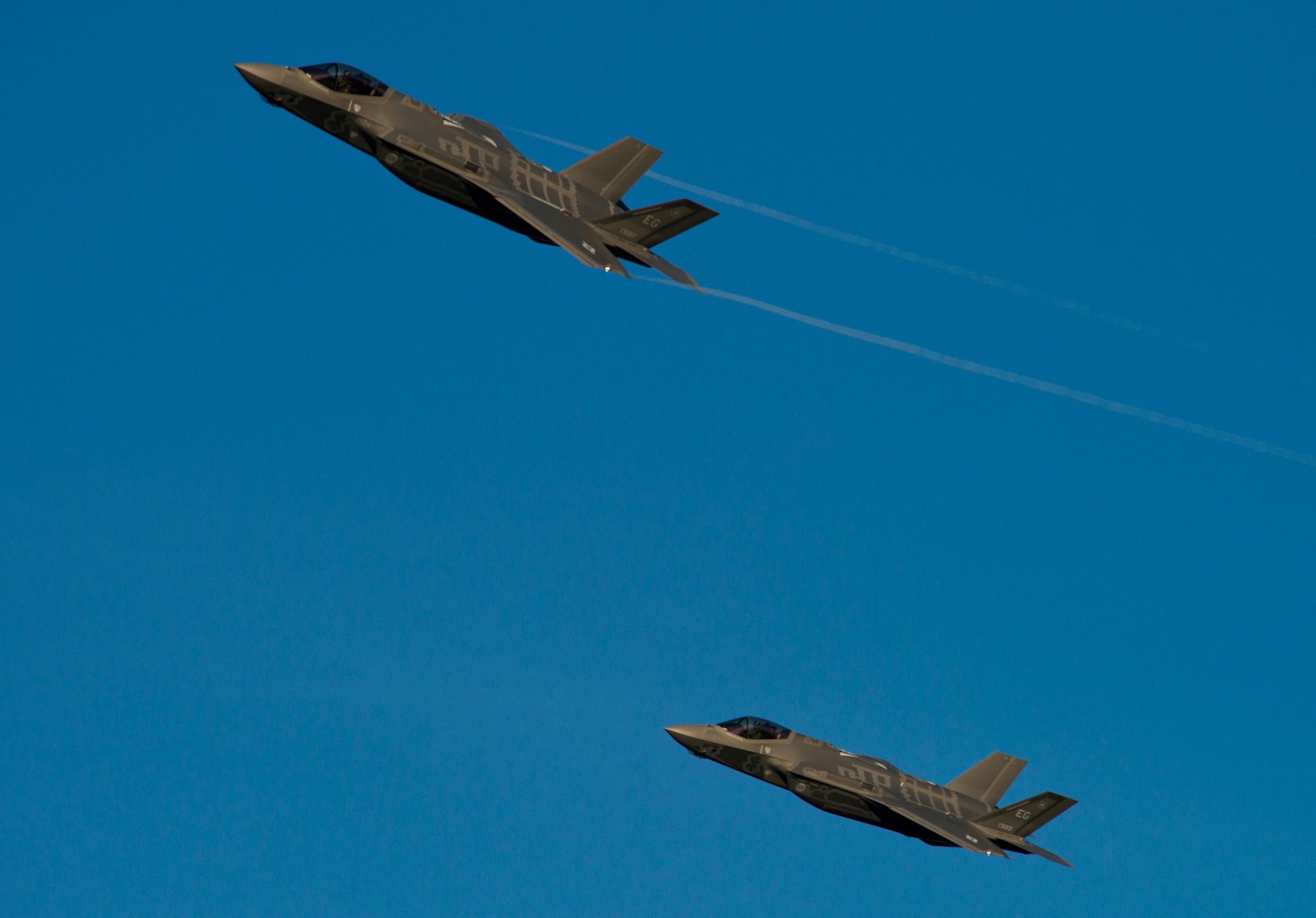 A pair of F-35A Lightning IIs rom the 33rd Fighter Wing streaks across the sky above Eglin Air Force Base, Fl. while coming in for landing after a training sortie. The 334rd Fighter Wing is responsible for F-35 A/B/C Lightning II pilot and maintainer training for the Marine Corps, the Navy, the Air Force and, in the future, at least eight coalition partners. Initially, 59 aircraft and three flying squadrons, one for each service/aircraft variant, will be established at Eglin. (U.S. Air Force photo/Tech. Sgt. Bennie J. Davis III)