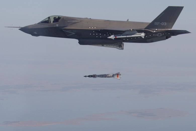 ATLANTIC OCEAN (Dec. 3, 2012) F-35B test aircraft BF-3, flown by Lt. Cmdr. Michael Burks, completes the first aerial weapons release of an inert 500-pound GBU-12 Paveway II laser-guided bomb by any variant of the F-35 Lightning II aircraft. BF-3 dropped the GBU-12 over the Atlantic Test Ranges from an internal weapons bay. The F-35B is the variant of the Lightning II designed for use by the U.S. Marine Corps, as well as F-35 international partners in the United Kingdom and Italy. The F-35B is capable of short takeoffs and vertical landings to enable air power projection from amphibious ships, ski-jump aircraft carriers and expeditionary airfields. The F-35B is undergoing flight test and evaluation at NAS Patuxent River, Md., prior to delivery to the fleet. (U.S. Navy photo courtesy of Lockheed Martin by Layne Laughter/Released) 121203-O-GR159-002
