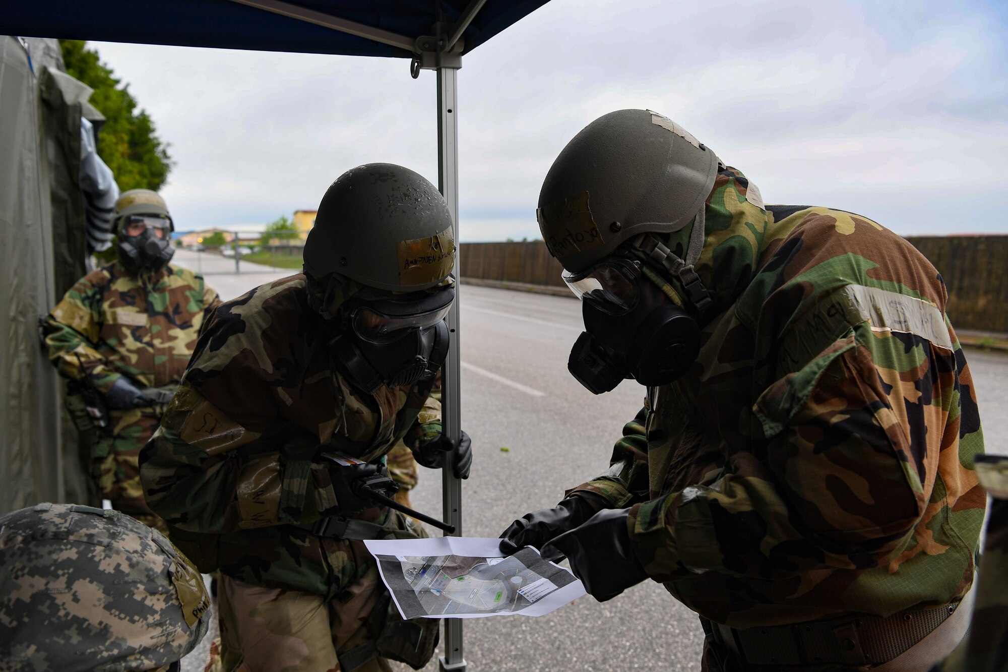 U.S. Airmen with the 724th Air Mobility Squadron prepare for a Personnel Accountability Report (PAR) check during exercise Nodal Lightning at Aviano Air Base, Italy, May 19, 2021. Nodal Lightning is a week-long readiness exercise for air mobility units around U.S. Air Forces in Europe. (U.S. Air Force photo by Airman 1st Class Thomas S. Keisler IV)
