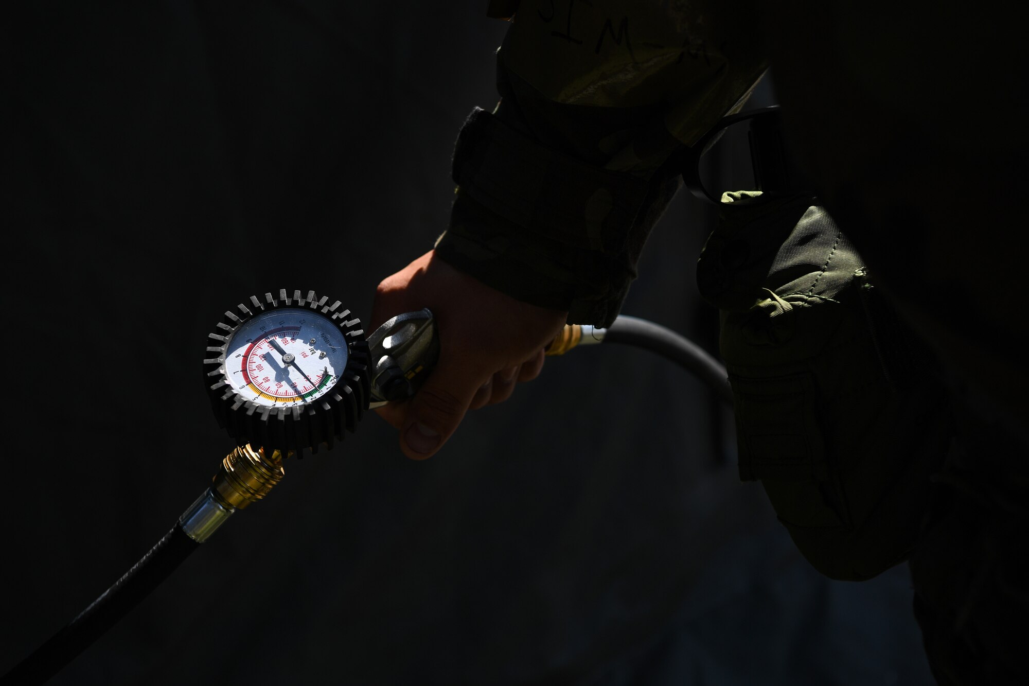A U.S. Airman with the 724th Air Mobility Squadron (AMS) fills an inflatable tent during Nodal Lightning at Aviano Air Base, Italy, May 18, 2021. Nodal Lightning is a readiness exercise that demonstrates how the 724th AMS would operate in a contested environment. (U.S. Air Force photo by Airman 1st Class Thomas S. Keisler IV)