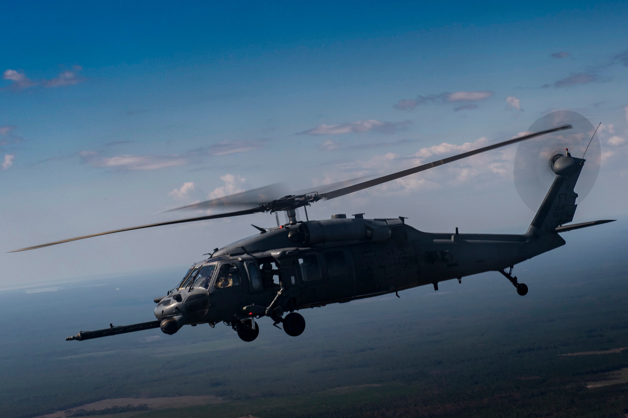 An HH-60G Pave Hawk from the 41st Rescue Squadron flies through the air during a rapid-rescue exercise, Nov. 3, 2016, near Tyndall Air Force Base, Fla.