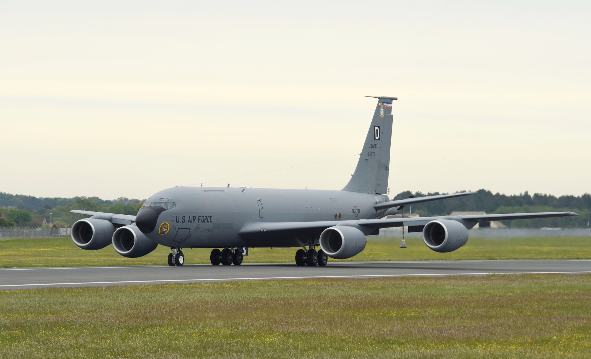 A U.S. Air Force KC-135 Stratotanker aircraft taxis down the runway during an elephant walk with a KC-10 Extender aircraft and a Royal Air Force A330 Voyager aircraft May 20, 2021, at RAF Mildenhall, England. The elephant walk was part of the European Tanker Symposium which brings tanker crew from NATO countries, along with other U.S. and Canadian forces together to share experiences and knowledge. (U.S. Air Force photo by Karen Abeyasekere)