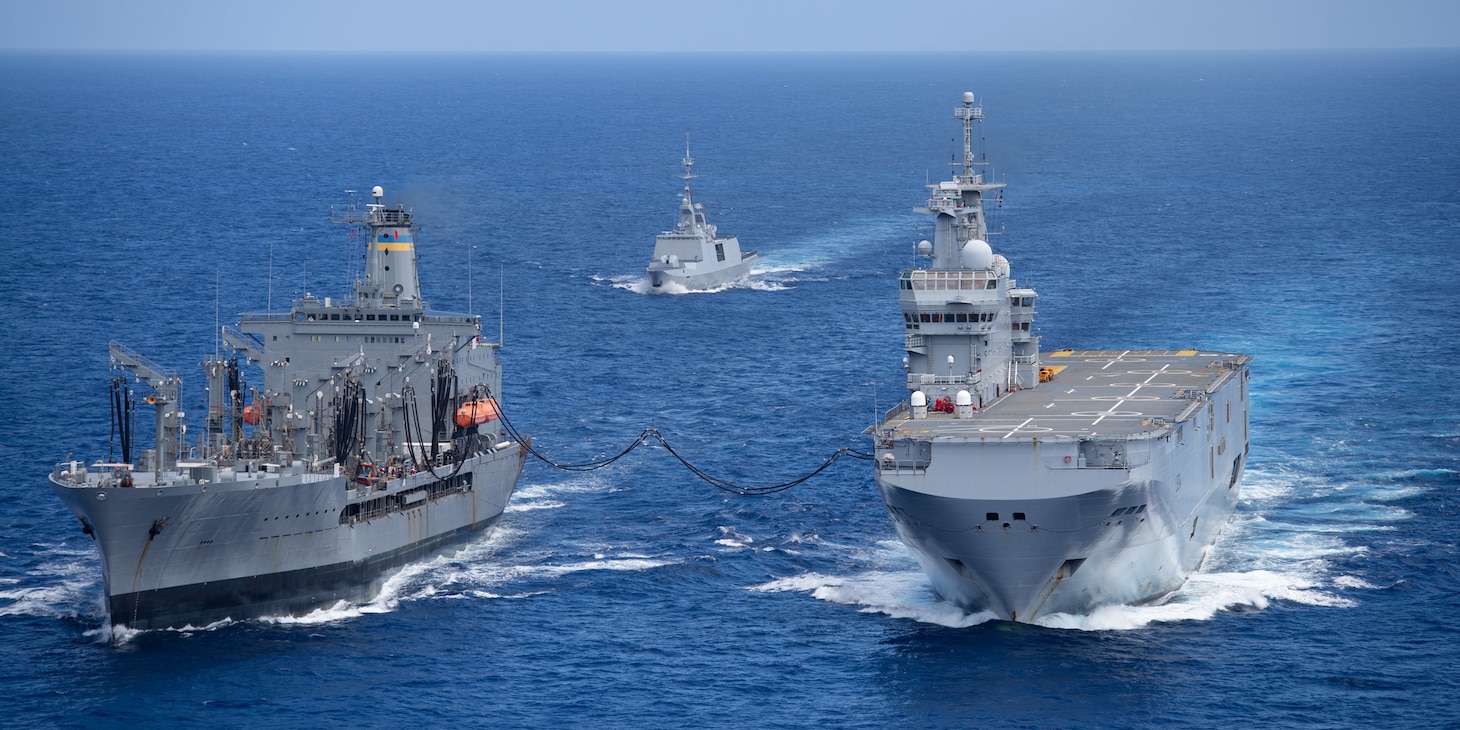 PHILIPPINE SEA (May 19, 2021) - The U.S. Navy's fleet replenishment oiler USNS Big Horn (T-AOE 6), left, conducts an underway replenishment with the French Navy's amphibious assault ship FS Tonnerre (L 9014), while the French frigate FS Surcouf (F711) follows. (Photo courtesy of the French Navy)