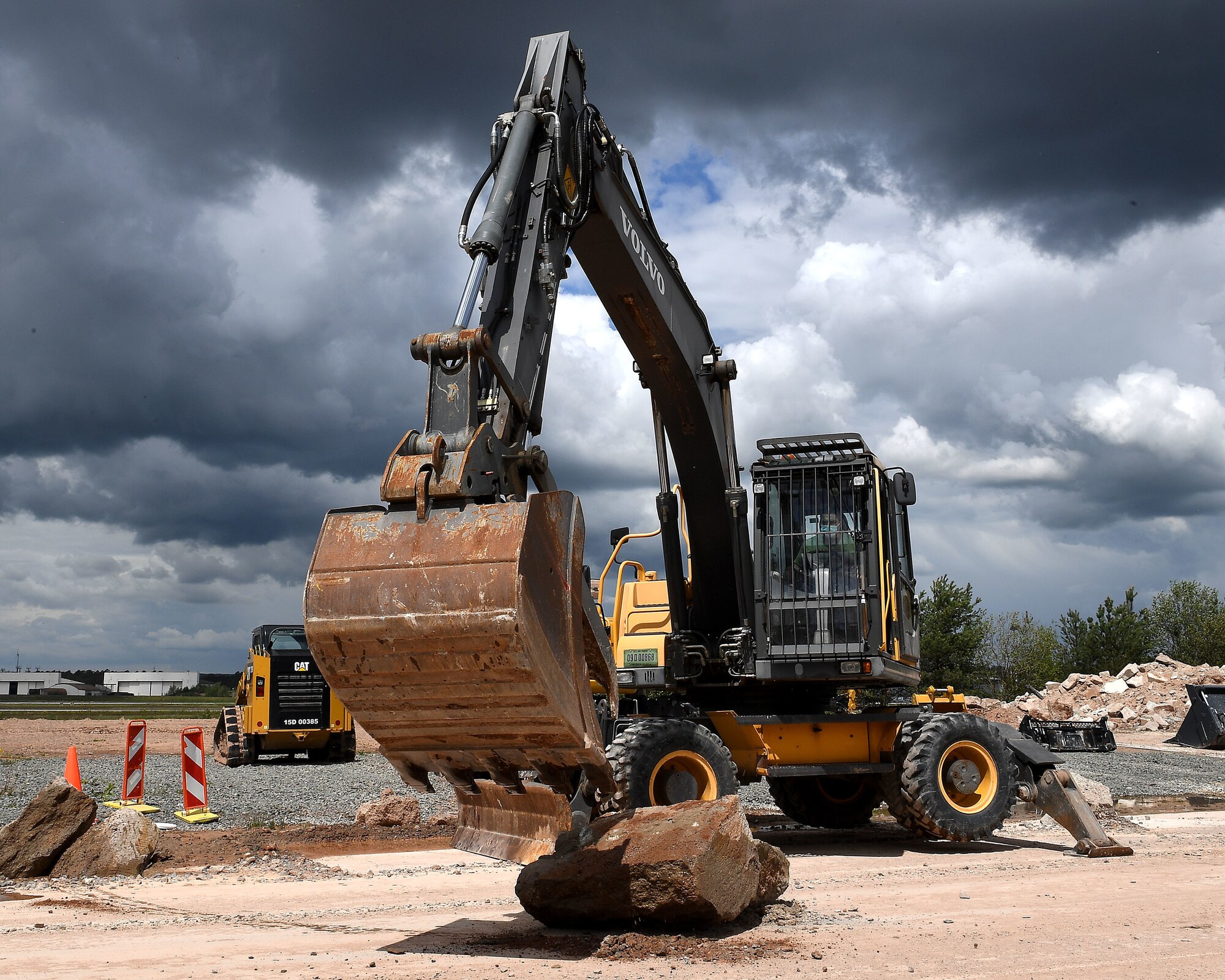 An excavator under the clouds