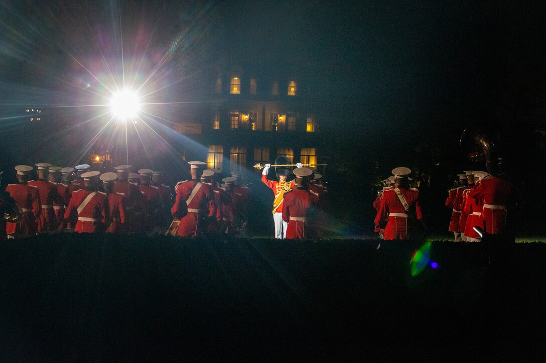 Marines with “The President’s Own,” U.S. Marine Band conduct “sound off” during the Friday Evening Parade at Marine Barracks Washington, May 21, 2021.