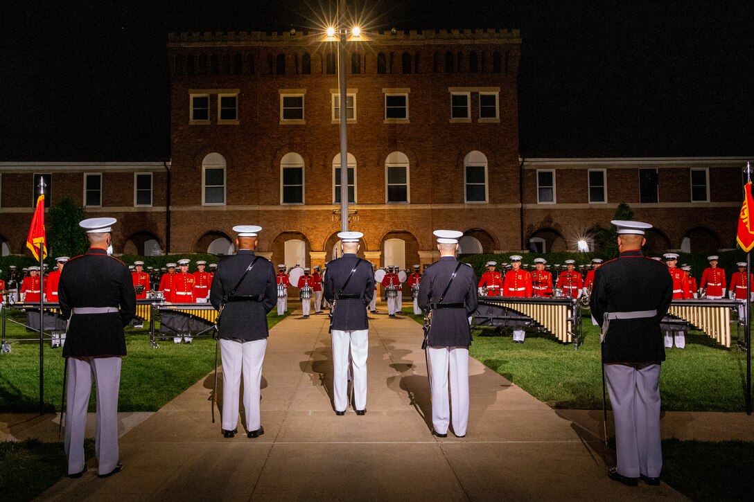 Marines with the parade staff stand at “ceremonial-at-ease” during the Friday Evening Parade at Marine Barracks Washington, May 21, 2021.