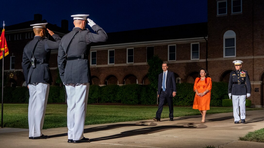 Captain Ryan Davis, protocol officer, left, and Col. Teague A. Pastel, right, render a salute during the Friday Evening Parade at Marine Barracks Washington, May 21, 2021. The guest of honor for the evening was Her Excellency Karen E. Pierce, DCMG British Ambassador to the United States, and the hosting official for the evening was Lt. Gen. Lewis A. Craparotta, commanding general, Training and Education Command. (U.S. Marine Corps photo by Sgt. Jason Kolela)