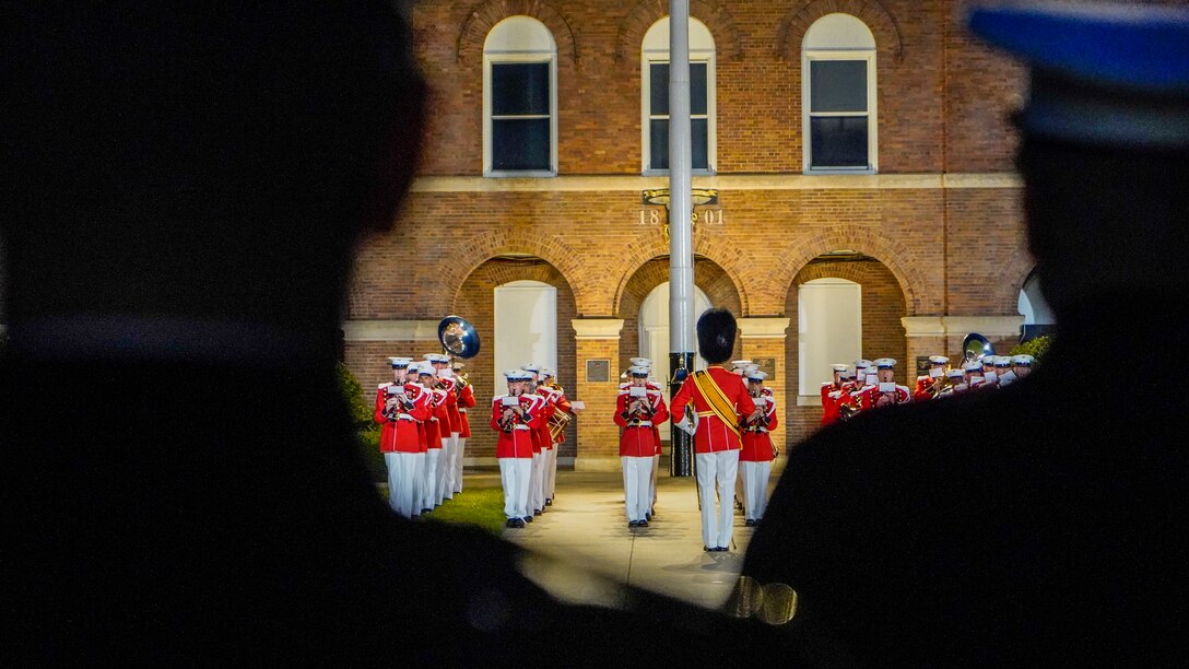 Marines with “The President’s Own,” U.S. Marine Band perform during the Friday Evening Parade at Marine Barracks Washington, May 21, 2021. The guest of honor for the evening was Her Excellency Karen E. Pierce, DCMG British Ambassador to the United States, and the hosting official for the evening was Lt. Gen. Lewis A. Craparotta, commanding general, Training and Education Command. (U.S. Marine Corps photo by Sgt. Jason Kolela)