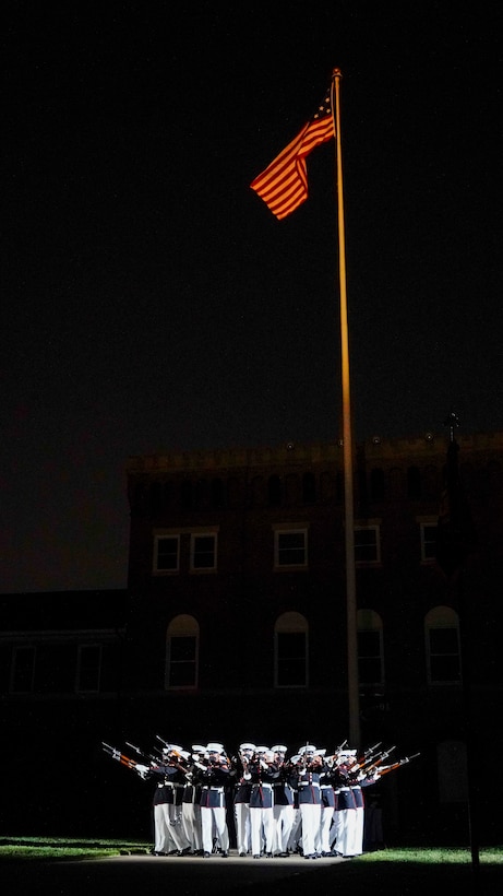 Marines with the Silent Drill Platoon execute their “bursting bomb” sequence during the Friday Evening Parade at Marine Barracks Washington, May 21, 2021.
