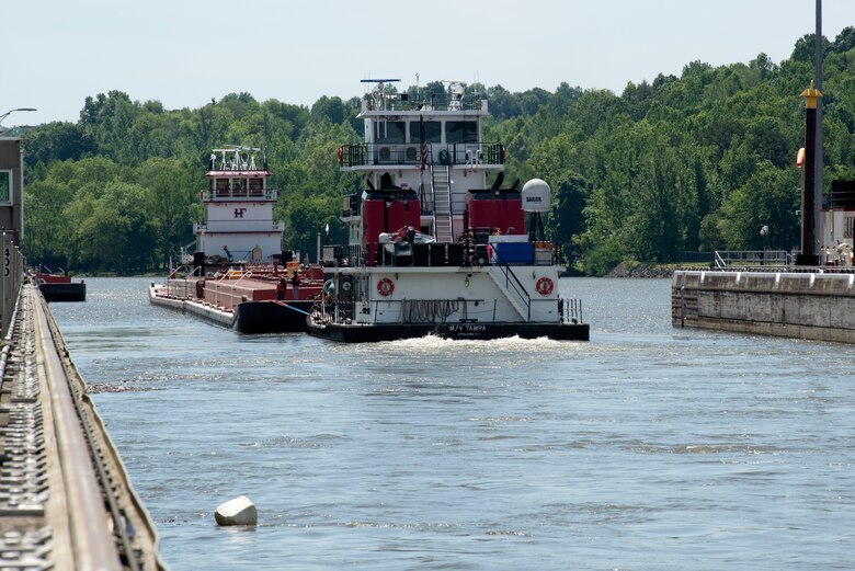 The Motor Vessel Tampa out of Ashland, Kentucky, and Motor Vessel Jess A. Mollineaux out of Nashville, Tennessee, guide Marathon Petroleum Company fuel barges May 21, 2021 out of Cheatham Lock in Ashland City headed to terminals in Nashville. The U.S. Army Corps of Engineers Nashville District worked with the fuel industry and Regional Rivers Repair Fleet, which is performing maintenance at the lock, to schedule openings to accommodate deliveries of fuel to Middle Tennessee. Each barge carries around 28,000 barrels of fuel. (USACE Photo by Lee Roberts)