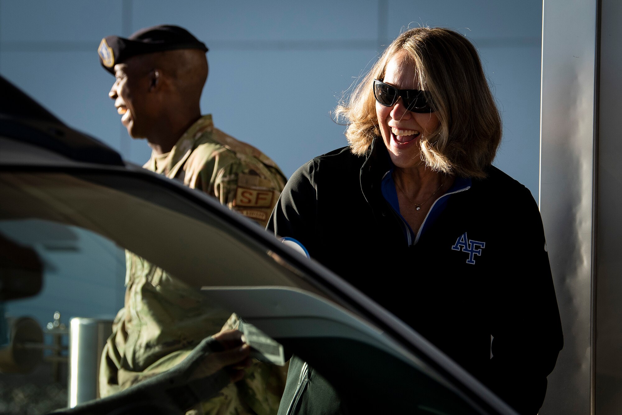 Jennifer Block, the executive director of the Air Force Academy’s athletic department, chats with a driver traveling through the north gate, May 20, 2021.