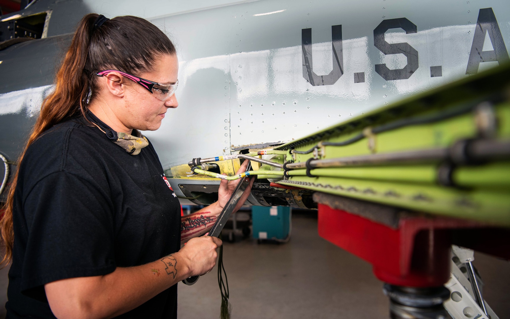 Woman working on an aircraft