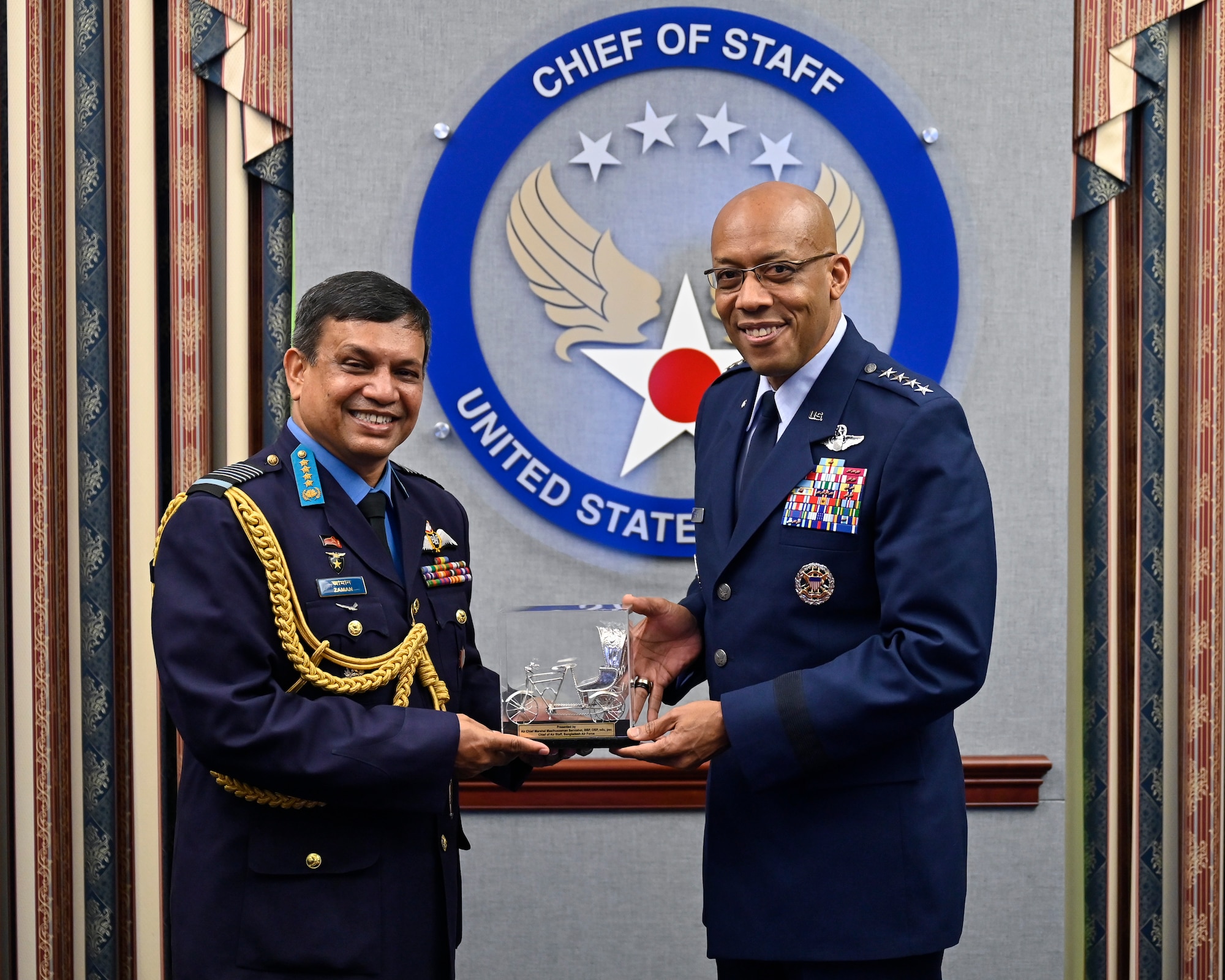 Air Force Chief of Staff Gen. Charles Q. Brown, Jr., right, poses with Air Chief Marshal Masihuzzaman Sernibat, chief of the air staff for the Bangladesh Air Force.