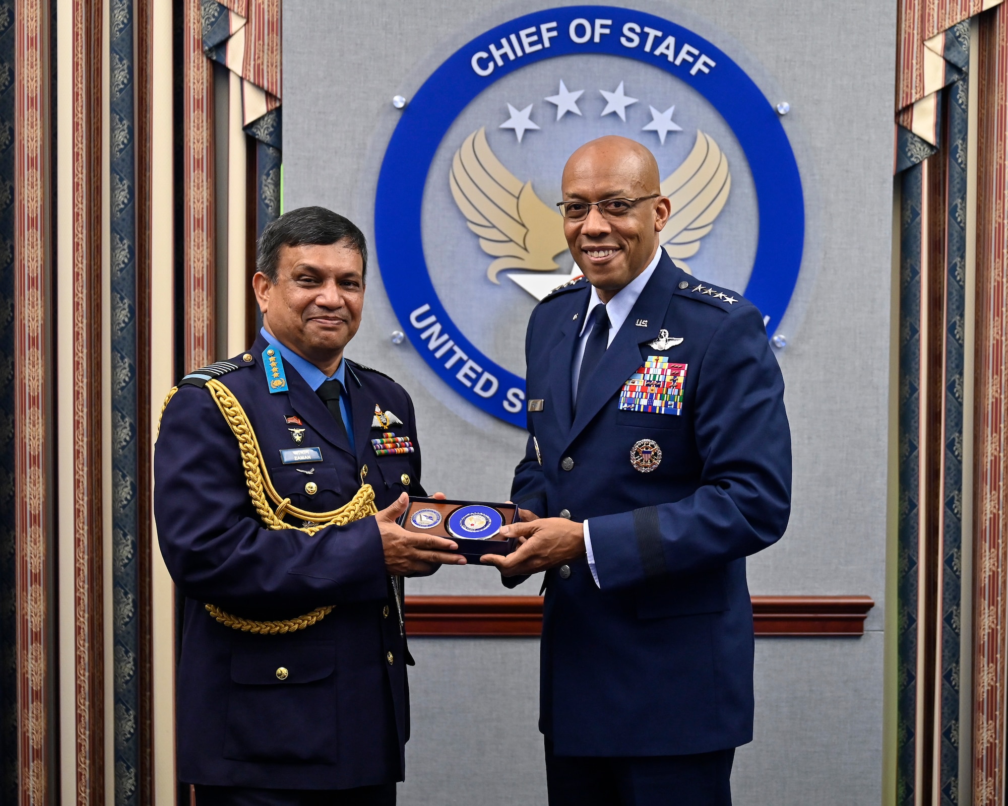 Air Force Chief of Staff Gen. Charles Q. Brown, Jr., right, poses with Air Chief Marshal Masihuzzaman Sernibat, chief of the air staff for the Bangladesh Air Force.