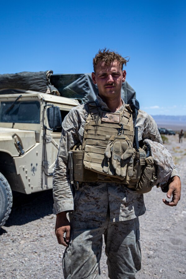U.S. Marine Corps Lance Cpl. Jacob Brehm, field artillery fire control Marine, Bravo Battery, 1st Battalion, 10th Marine Regiment, preparing for Enhanced Motorized Operations Course at Marine Corps Air Ground Combat Center, Twentynine Palms, California, May 18, 2021. The EMOC strengthens a training unit’s proficiency in live-fire convoy operations, while incorporating overhead artillery support by fire. (U.S. Marine Corps photo by Lance Cpl. Joshua Sechser)