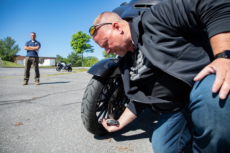 Rick Mocarski, U.S. Army Corps of Engineers Transatlantic Middle East District information technology specialist, goes through the steps and devices used for checking motorcycle tire air pressure during a Transatlantic Division motorcycle safety training course at the division headquarters in Winchester Va., May 13, 2021. (U.S. Army Photo by Sherman Hogue, U.S. Army Corps of Engineers Transatlantic Division public affairs office)