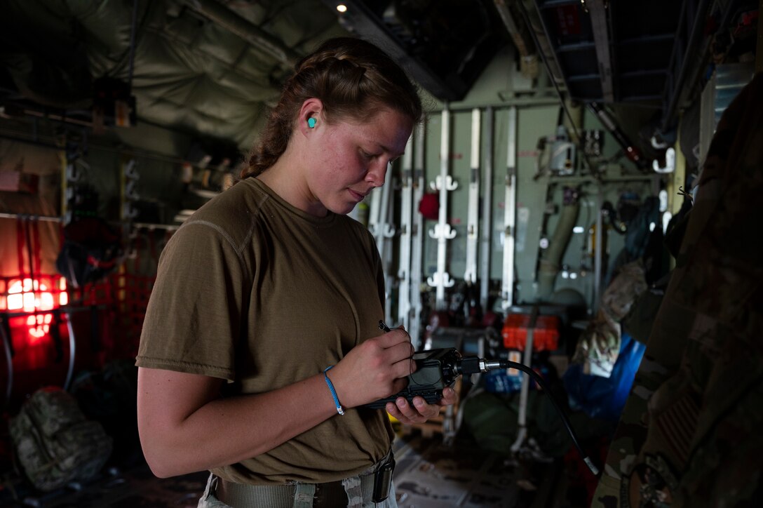 An Airman prepares pre-flight checks of a C-130J