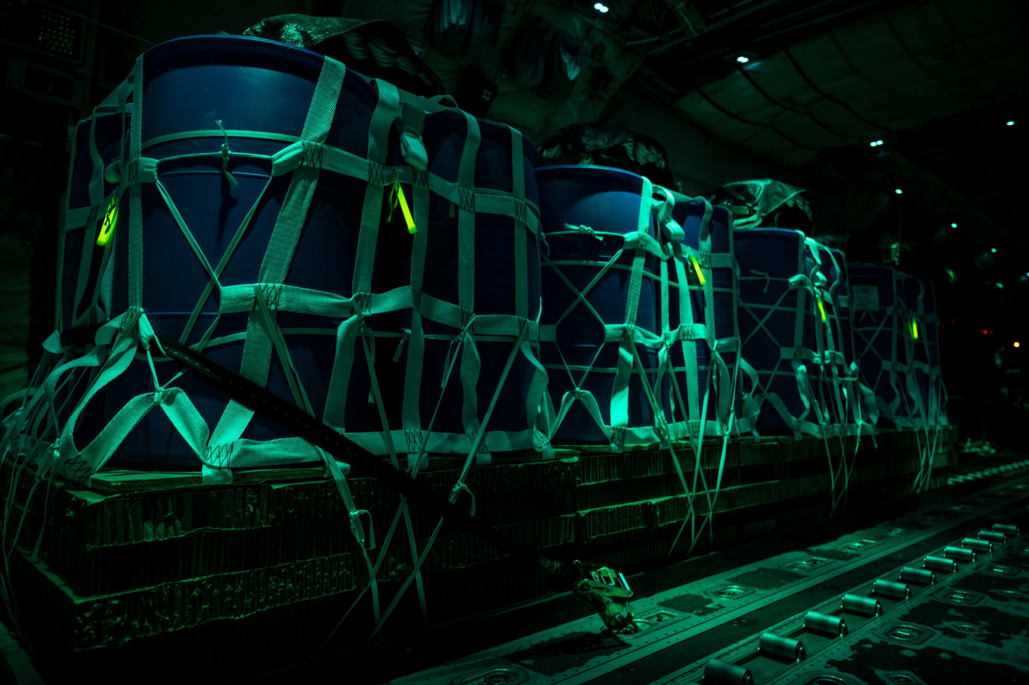 Container delivery systems rest on a C-130J