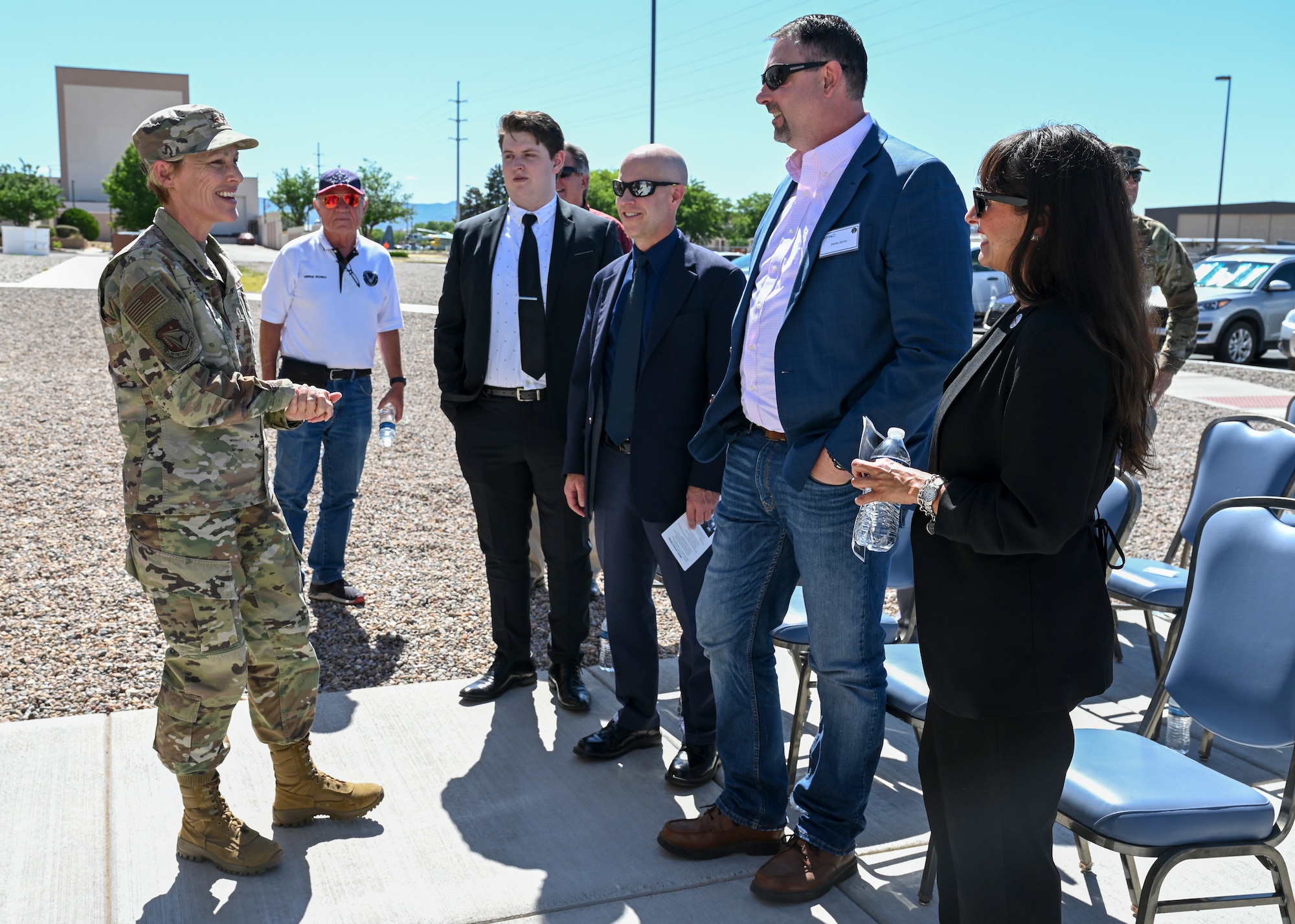 Following the ribbon cutting ceremony May 20 for a new Air Force Research Laboratory facility at Kirtland AFB, N.M., AFRL Commander Maj. Gen. Heather Pringle speaks with guests Synthia Jaramillo, Albuquerque Director of Economic Development; Jason Jarvis representing U.S. Senator Martin Heinrich; Matt Miller representing U.S. Congresswoman Teresa Leger Fernandez; and Angelo Champion representing U.S. Senator Ben Ray Lujan, while Sherman McCorkle CEO and founder of the Kirtland Partnership Committee looks on. (U.S. Air Force photo/Tech. Sgt. Jenna Bigham)