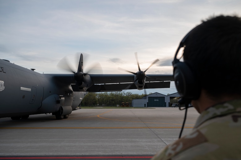 An Airman performs an engine check