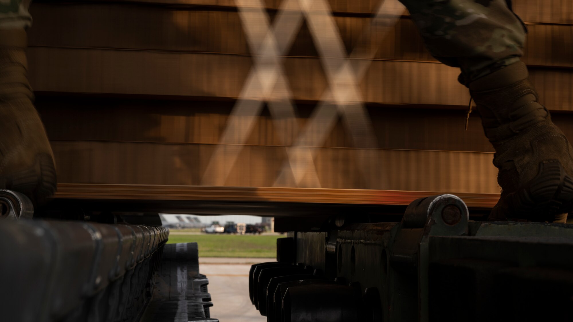 An Airman transfers a container delivery system