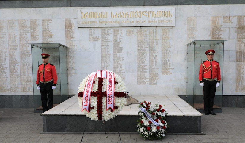 U.S. ambassador to Georgia Kelly C. Degnan and members of the Walter Reed Army Institute of Research's U.S. Army Medical Research Directorate-Georgia laids wreaths in Hero's Square to commemorate the fall of Sokhumi in Georgia 27 years ago.