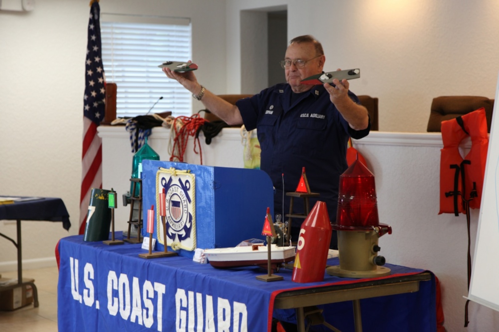 RIVIERA BEACH, Fla. - Coast Guard Auxiliary member Steve Seidman, a Coast Guard certified instructor, uses visual aids to teach recreational mariners the basics about nautical navigation during a boating safety course in Palm Beach Shores, Fla., Sep. 16, 2012. The course is designed to teach boaters the basics about boat handling and safety. Coast Guard Photo by Petty Officer 1st Class Krystyna A. Hannum