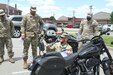 soldier inspects motorcycle