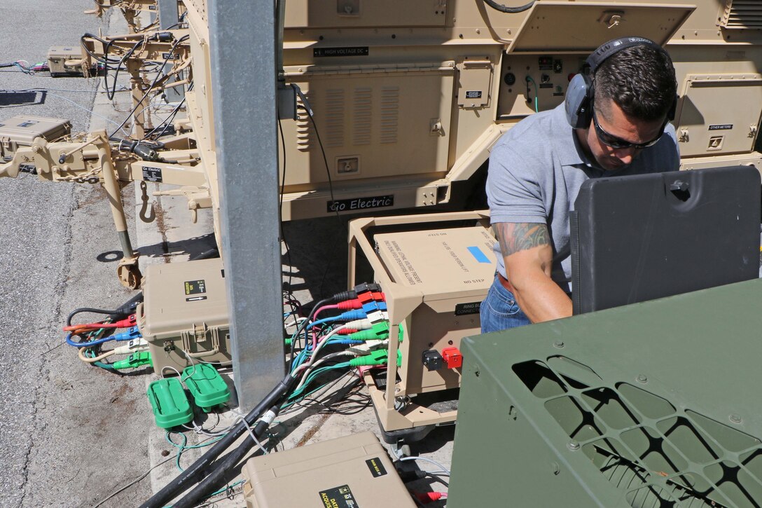 A man works on a power system.