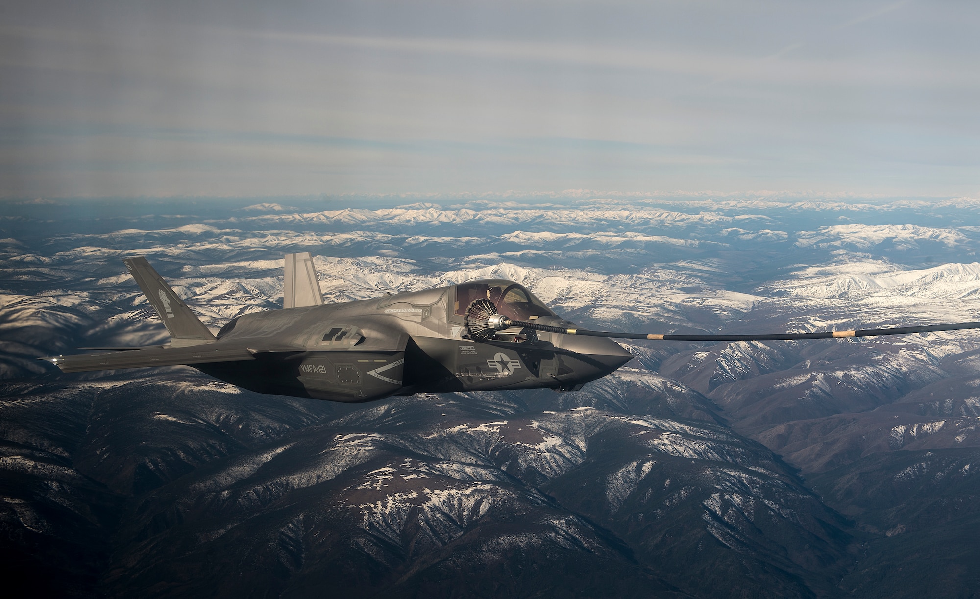 A U.S. Marine Corps F-35B Lightning II attached to the Marine Fighter Attack Squadron 121 receives fuel from a KC-130J Hercules during exercise Northern Edge 19, May 13, 2019 at Joint Base Elmendorf-Richardson, Alaska. Northern Edge provides effective, capabilities-centered joint forces, ready for deployment world-wide and enables real-world proficiency in detection, identification and tracking of units at sea, in the air and on land and respond to multiple crises in the Indo-Pacific region. (U.S. Air Force photo by Master Sgt. Nathan Lipscomb)
